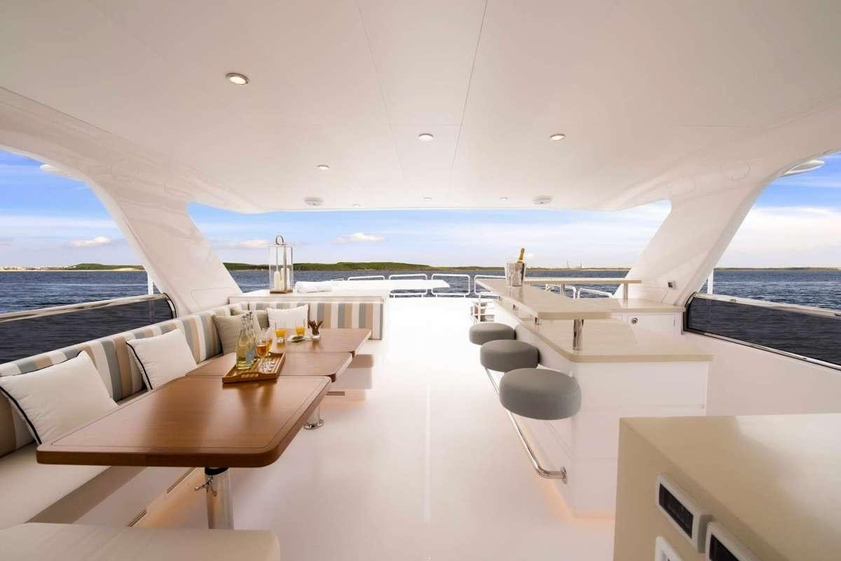 a room with a view of the water and the land below aboard AQUA LIFE Yacht for Charter