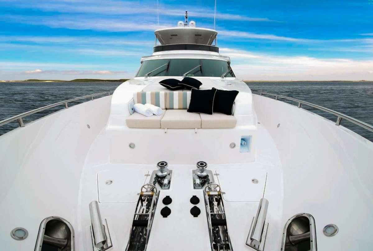 a white yacht on a dock aboard AQUA LIFE Yacht for Charter