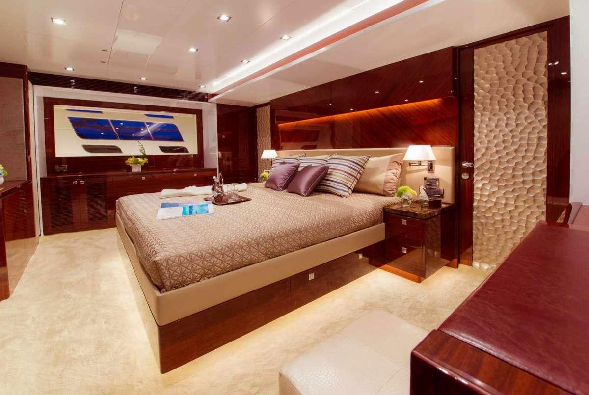 a large bed in a room aboard AQUA LIFE Yacht for Charter