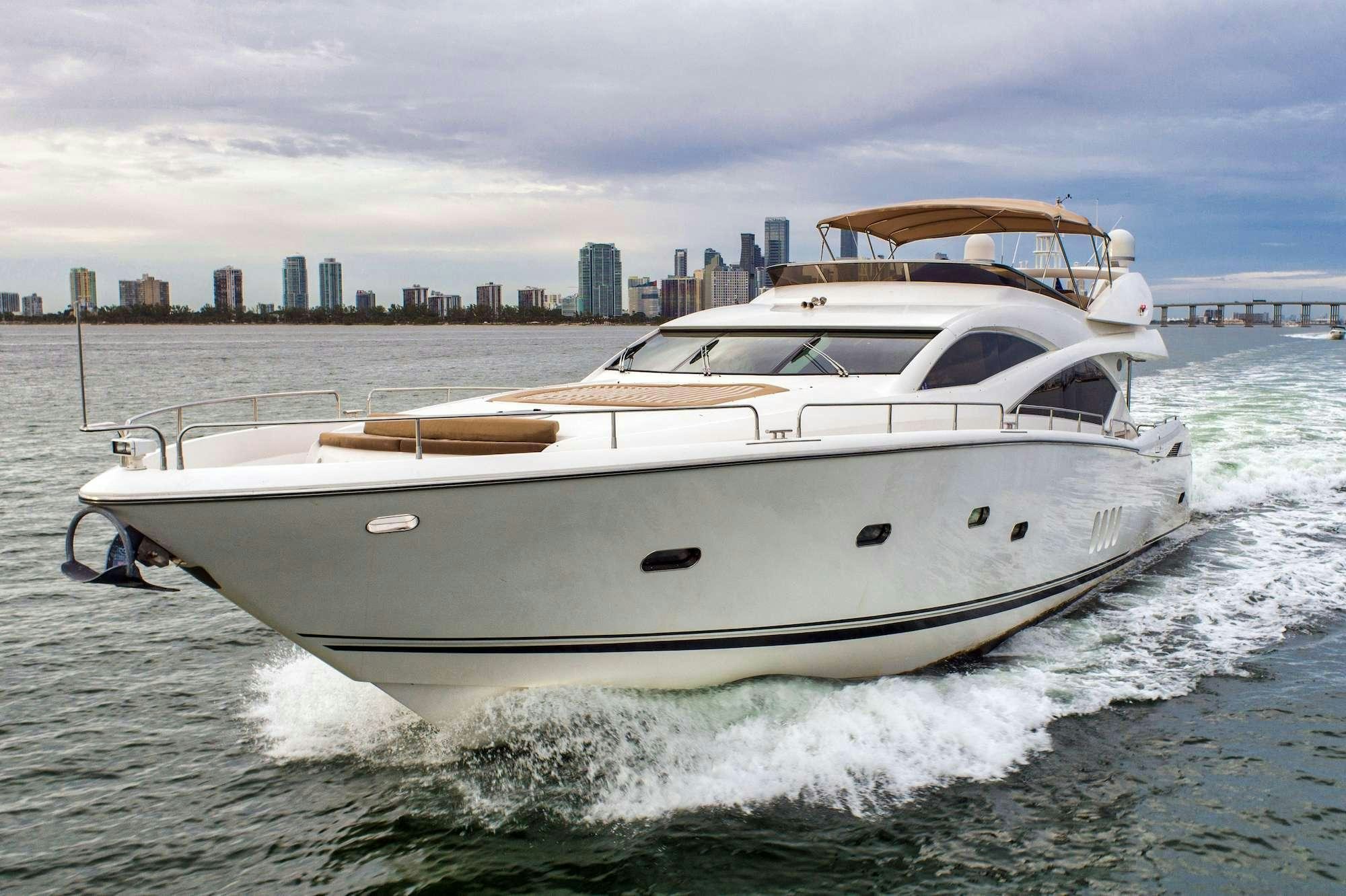 a white yacht on the water aboard acqua alberti Yacht for Charter