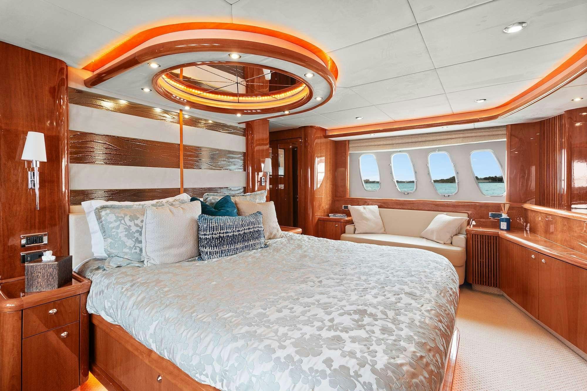 a large bed in a room aboard acqua alberti Yacht for Charter