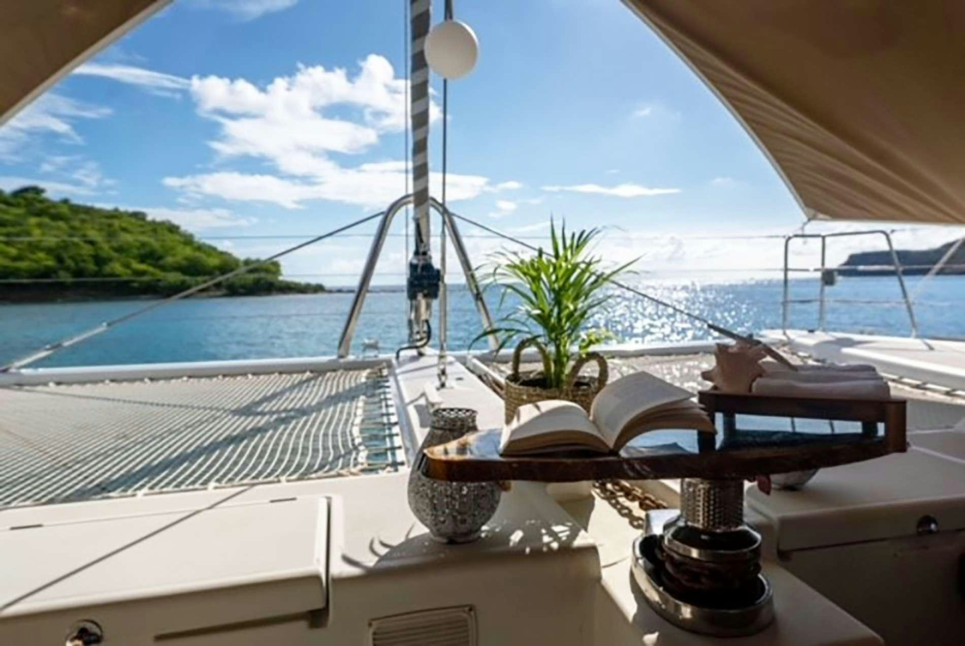 a table with a plant on it aboard THE RECIPE Yacht for Charter