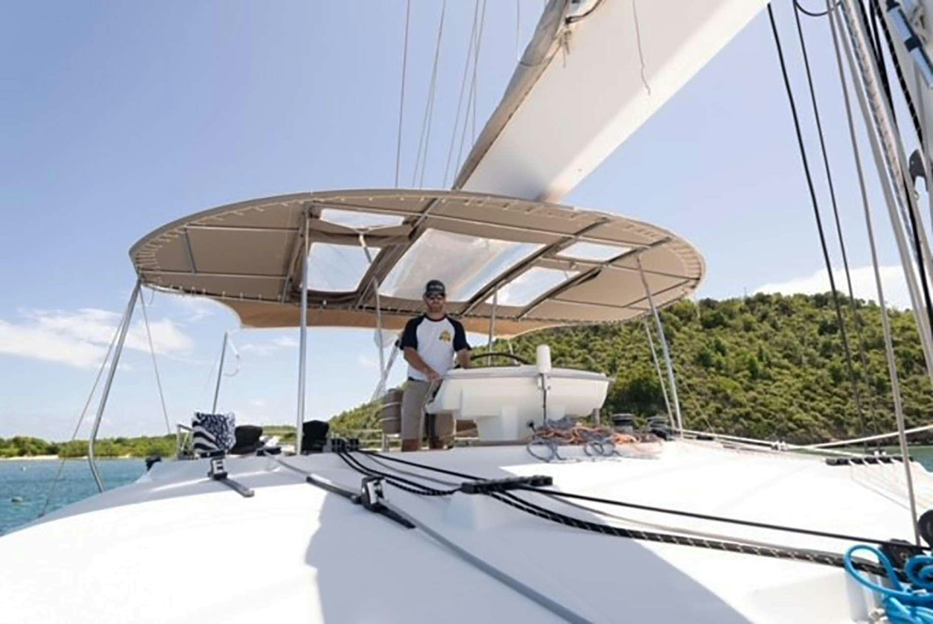 a person standing on a boat aboard THE RECIPE Yacht for Charter