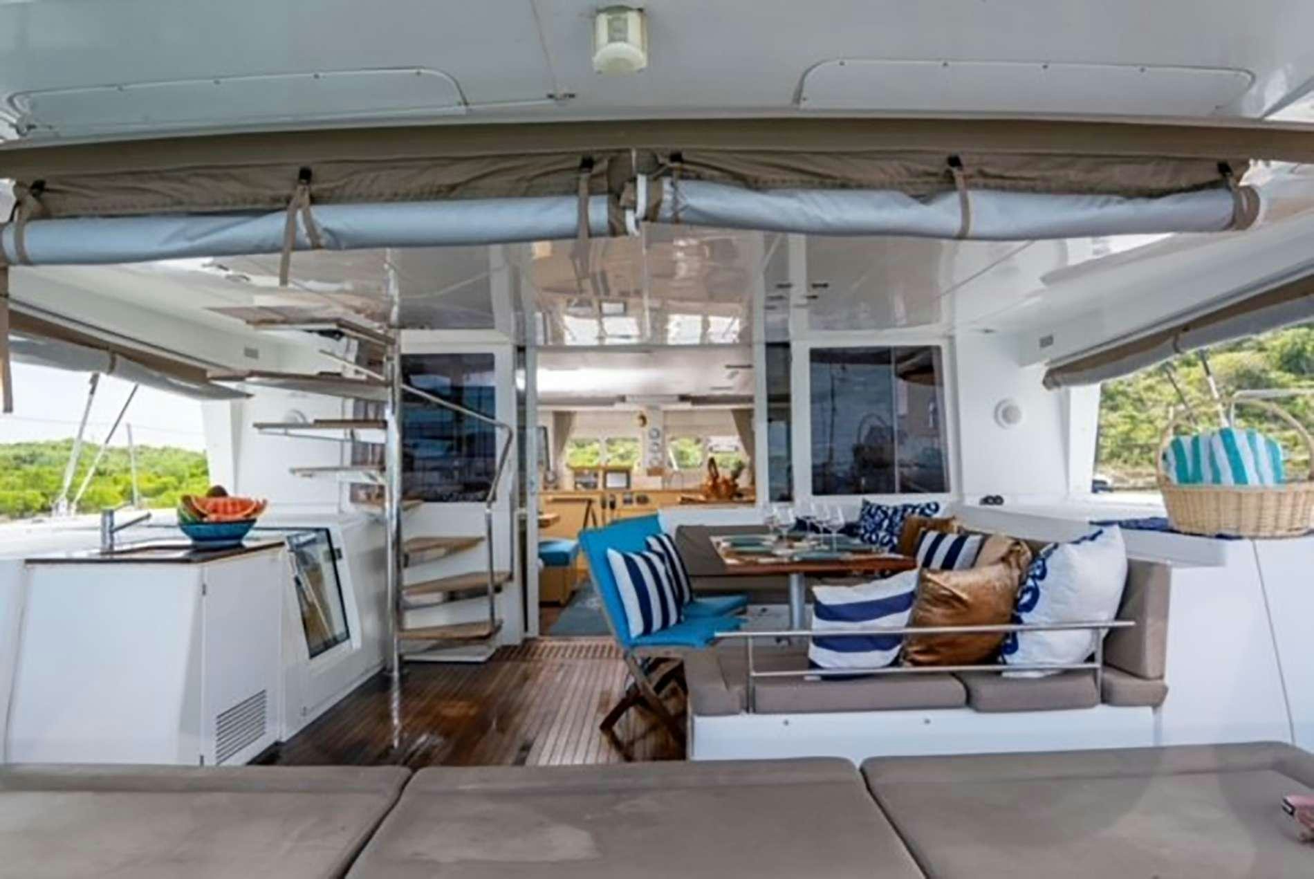 a room with a couch and a table aboard THE RECIPE Yacht for Charter