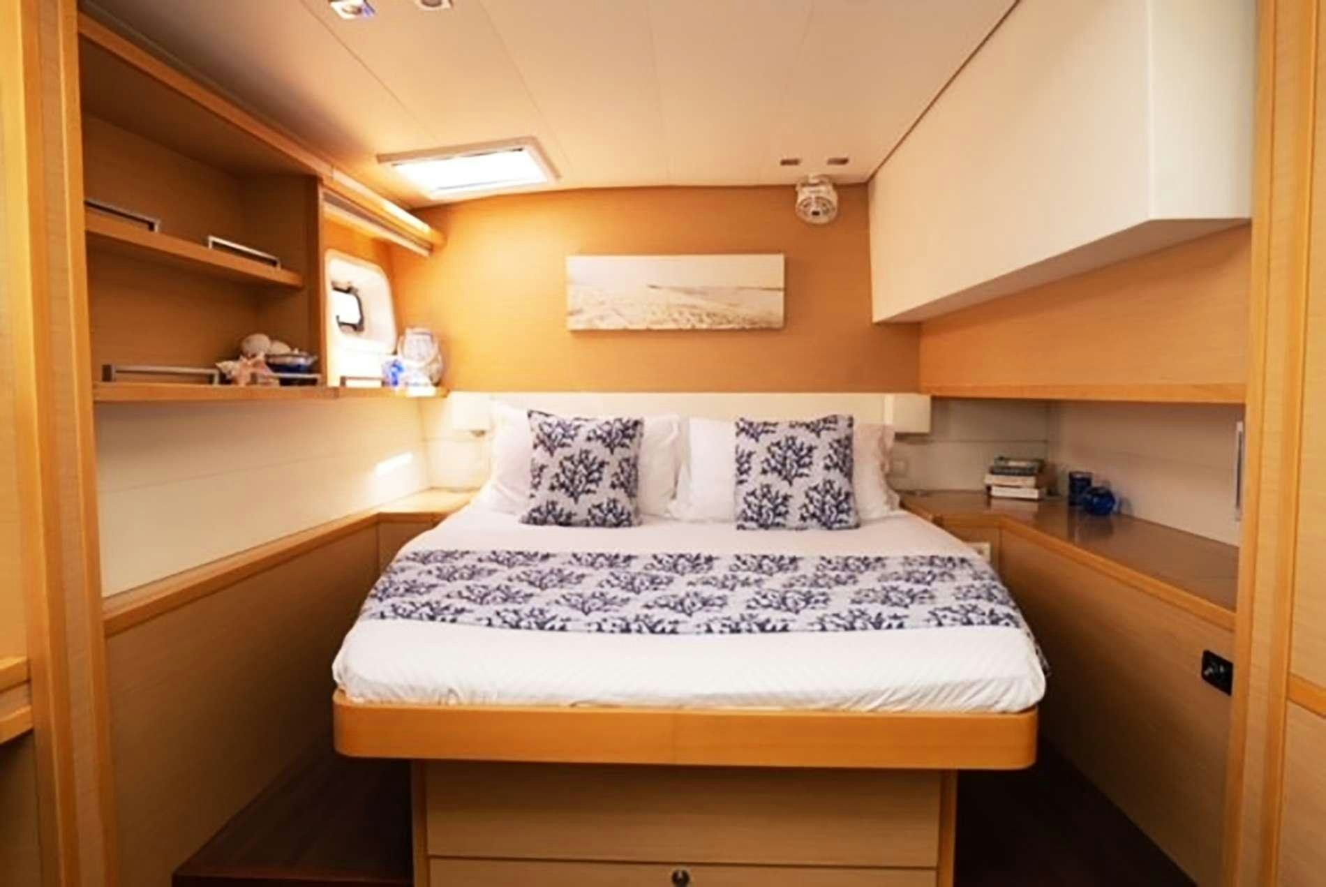 a bed in a room aboard THE RECIPE Yacht for Charter