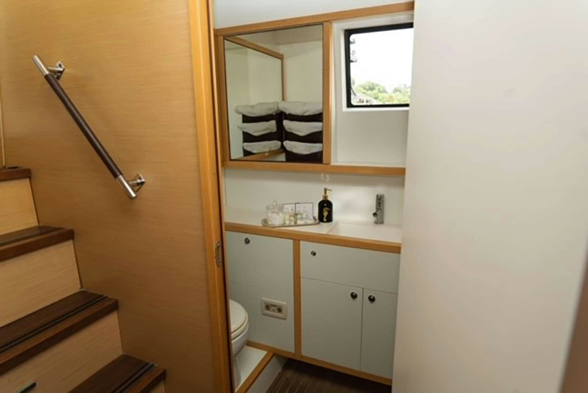 a bathroom with a shower and a sink aboard THE RECIPE Yacht for Charter
