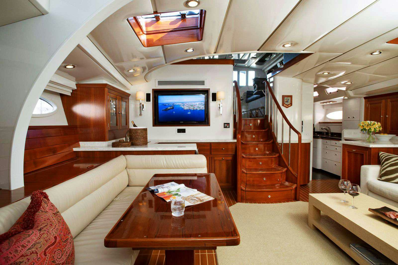 a living room with a large television aboard FALCON Yacht for Charter