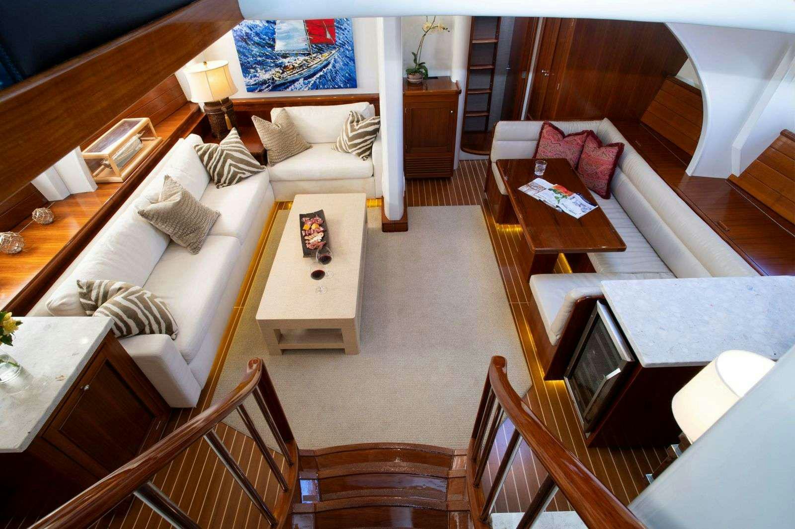 a living room with a couch and a table aboard FALCON Yacht for Charter