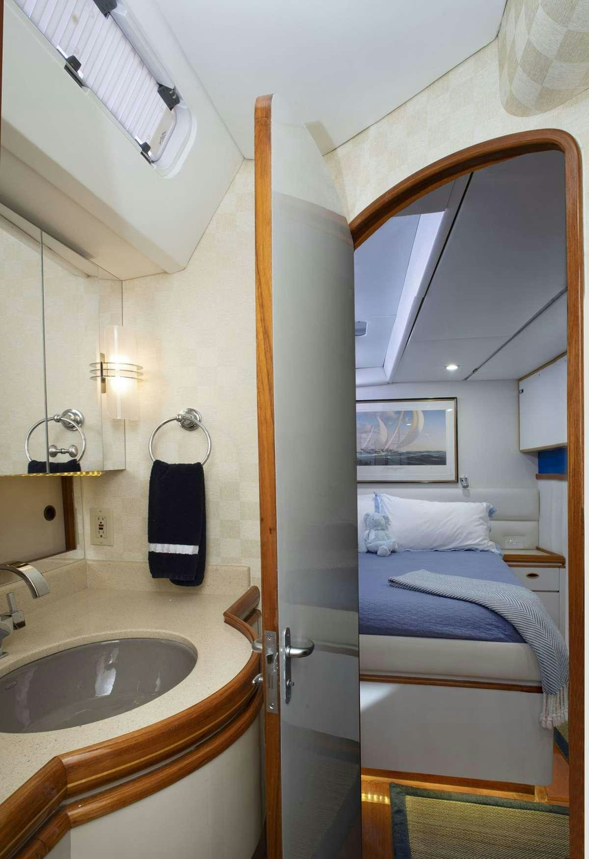 a bathroom with a sink and a mirror aboard FALCON Yacht for Charter