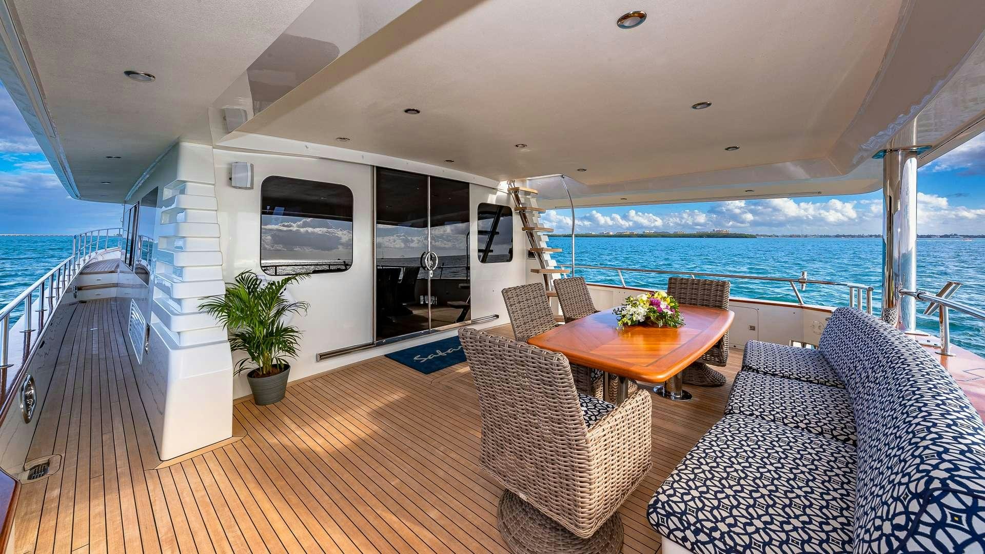 a living room with a large body of water aboard SAFARI Yacht for Charter