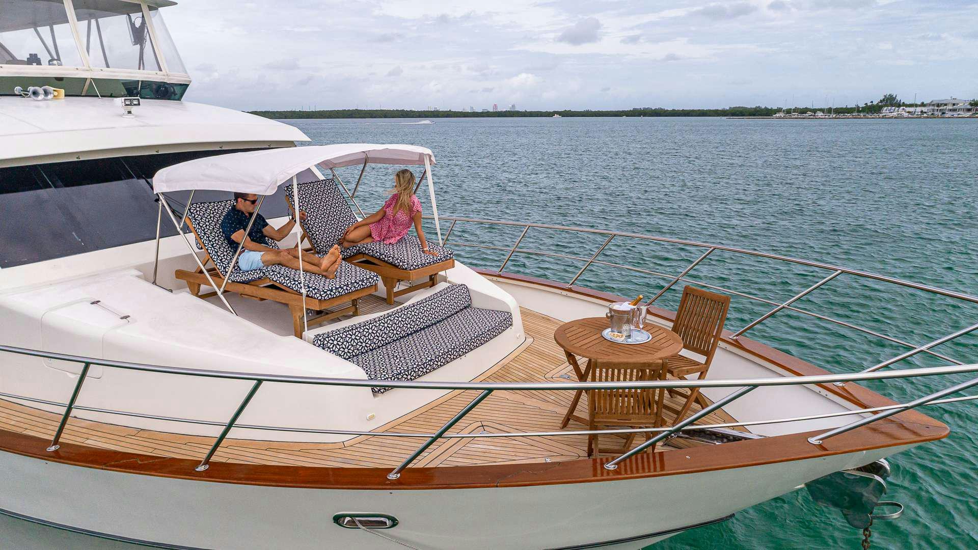 a group of people sitting on a boat on the water aboard SAFARI Yacht for Charter