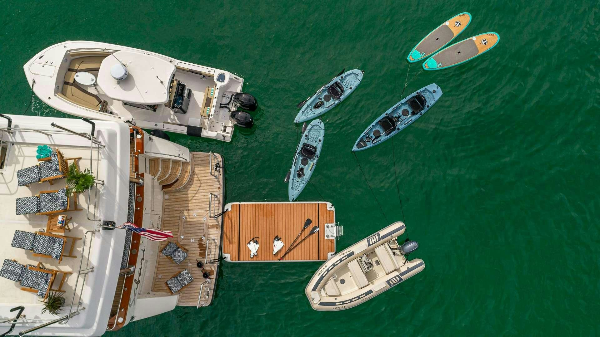 a group of boats on a body of water aboard SAFARI Yacht for Charter