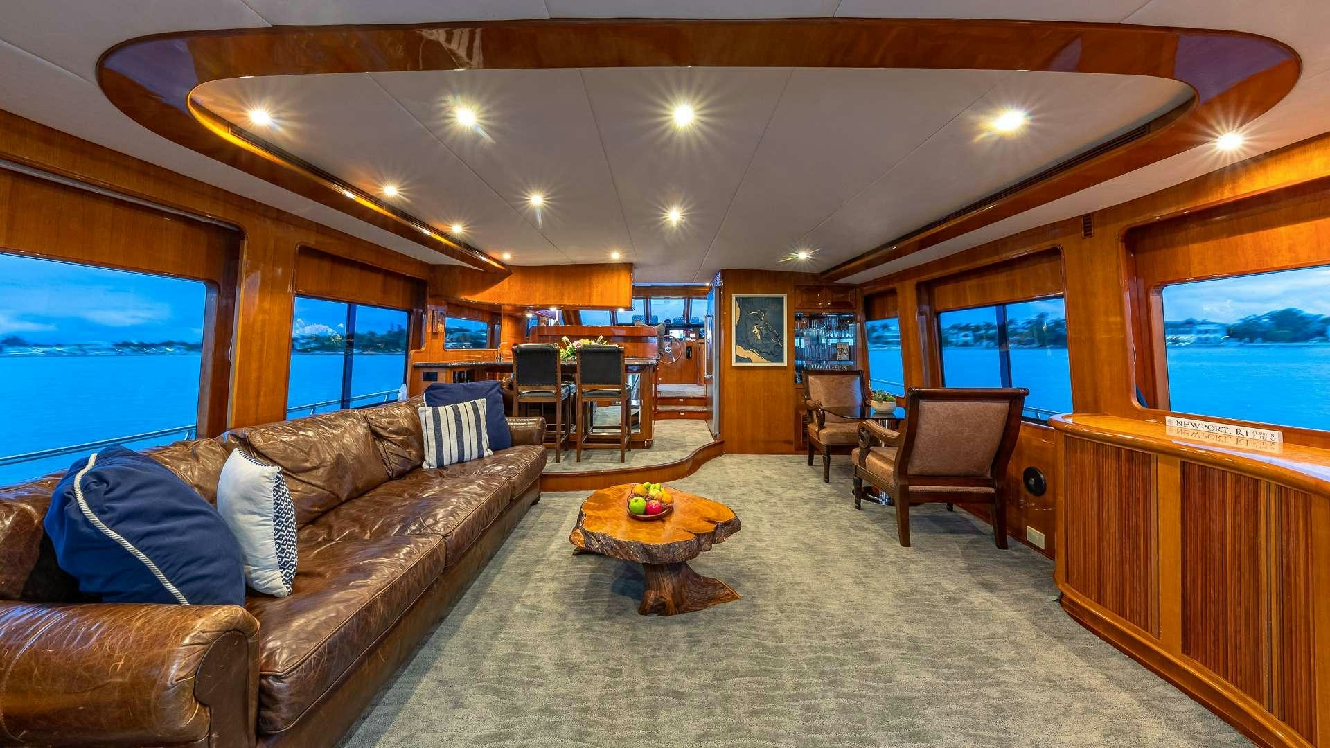 a living room with a couch and a tv aboard SAFARI Yacht for Charter
