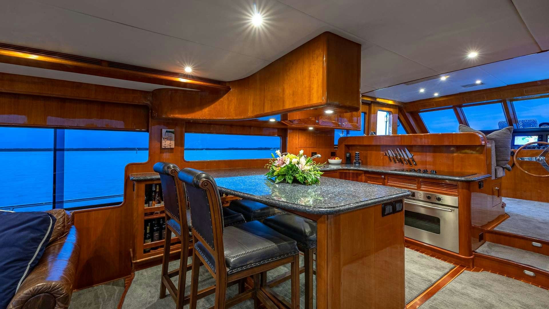 a room with a table and chairs aboard SAFARI Yacht for Charter