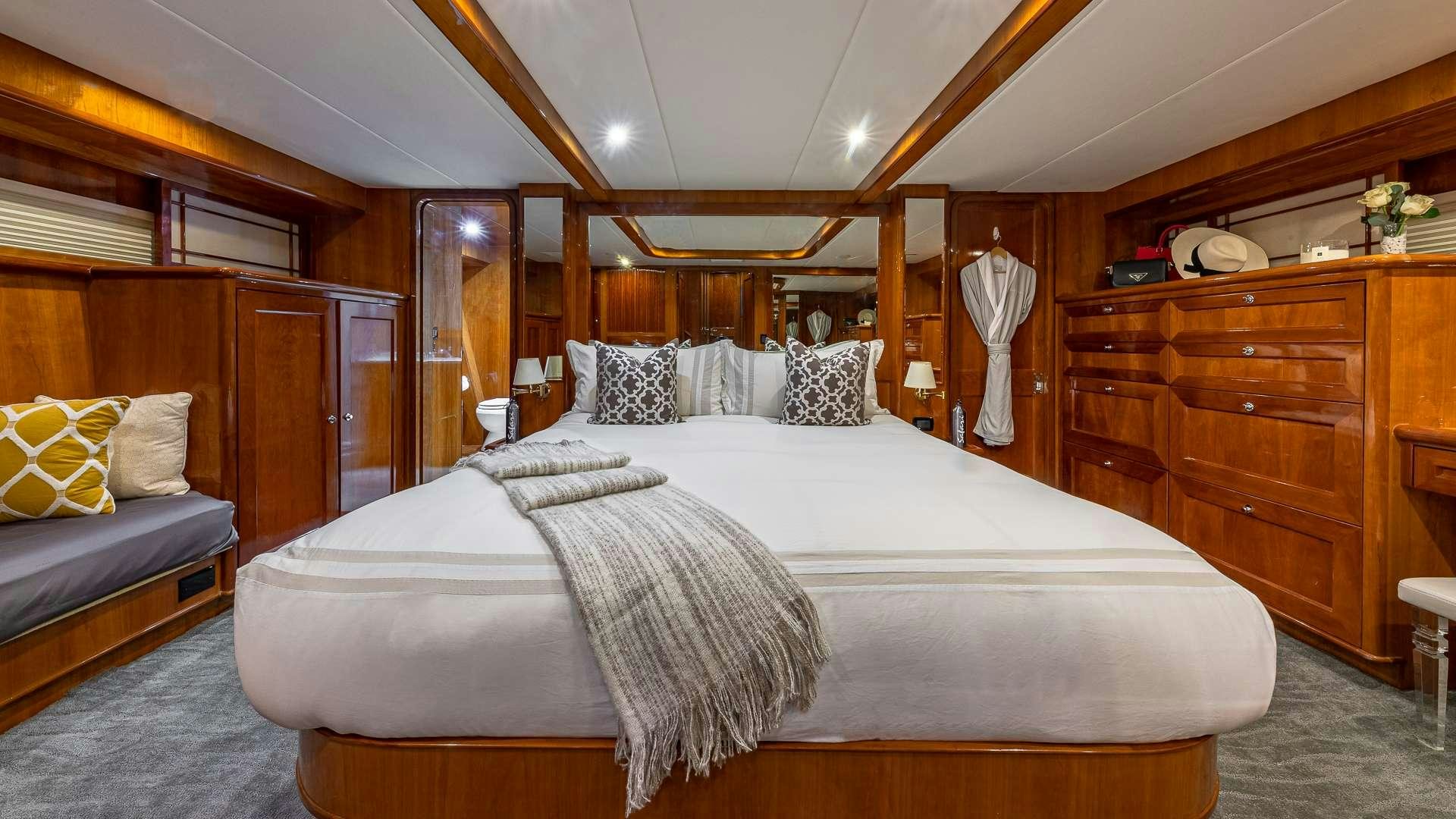 a large bed in a room aboard SAFARI Yacht for Charter