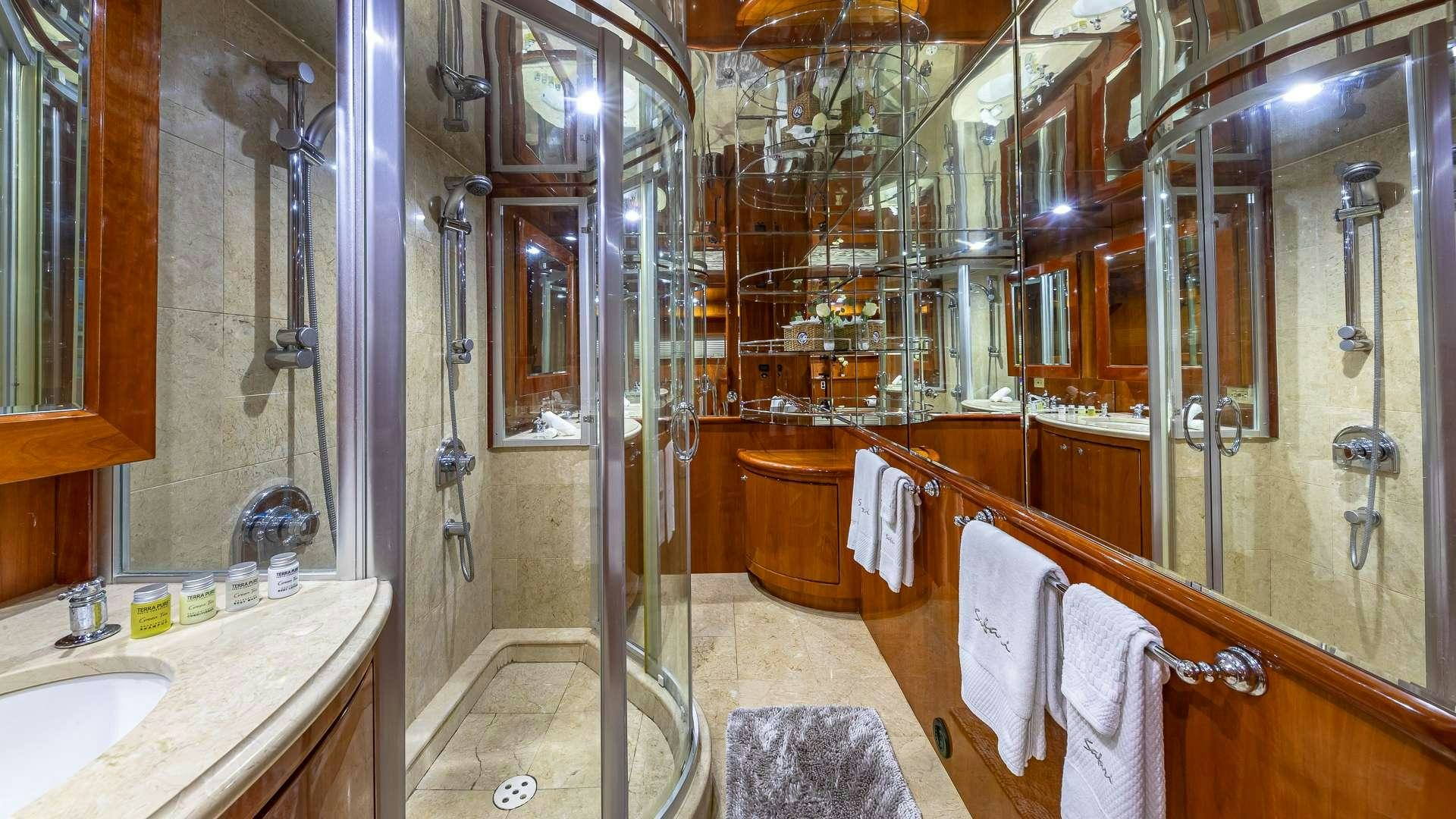 a bathroom with a shower unit and sink aboard SAFARI Yacht for Charter