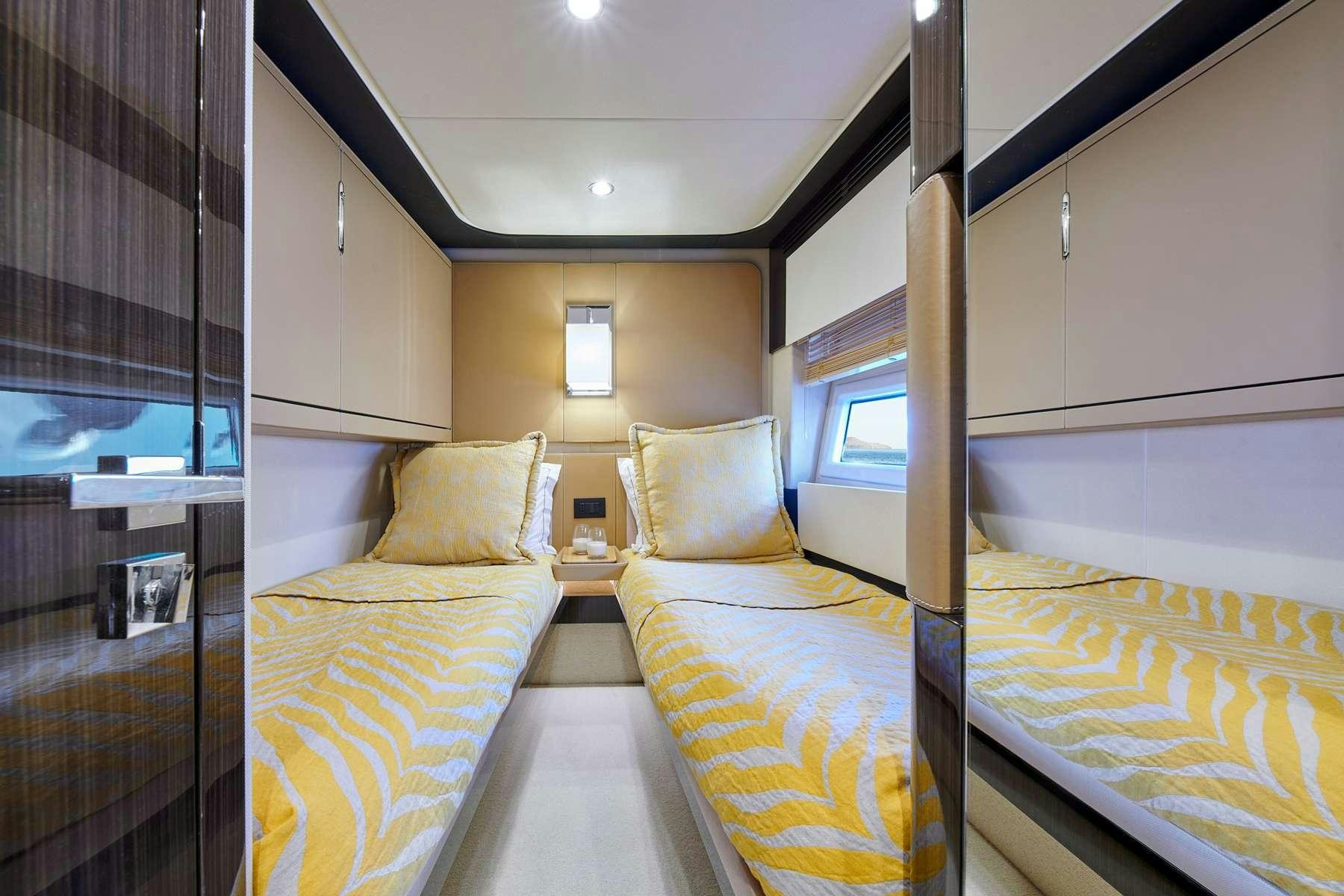 a room with a bed and a window aboard ALKYONE Yacht for Charter
