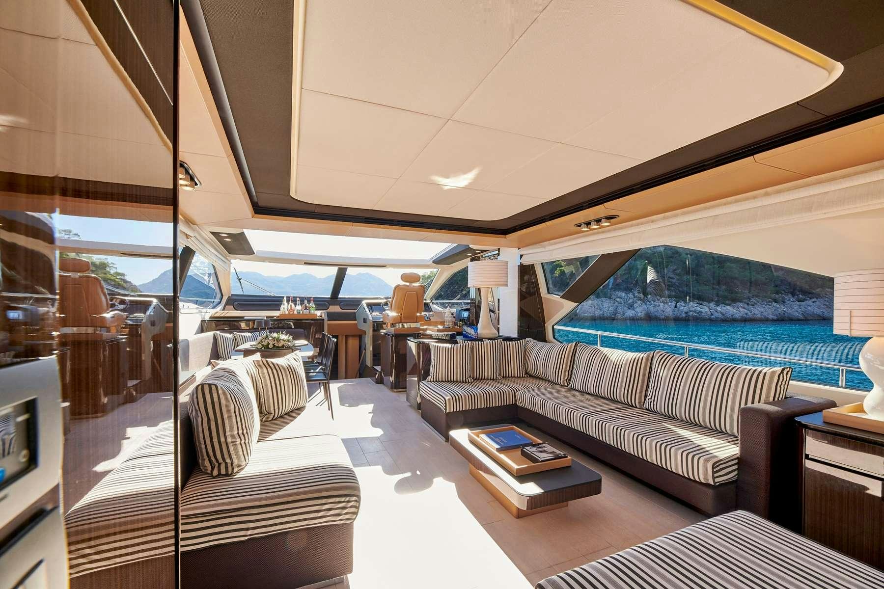 a room with a bed and a table aboard ALKYONE Yacht for Charter
