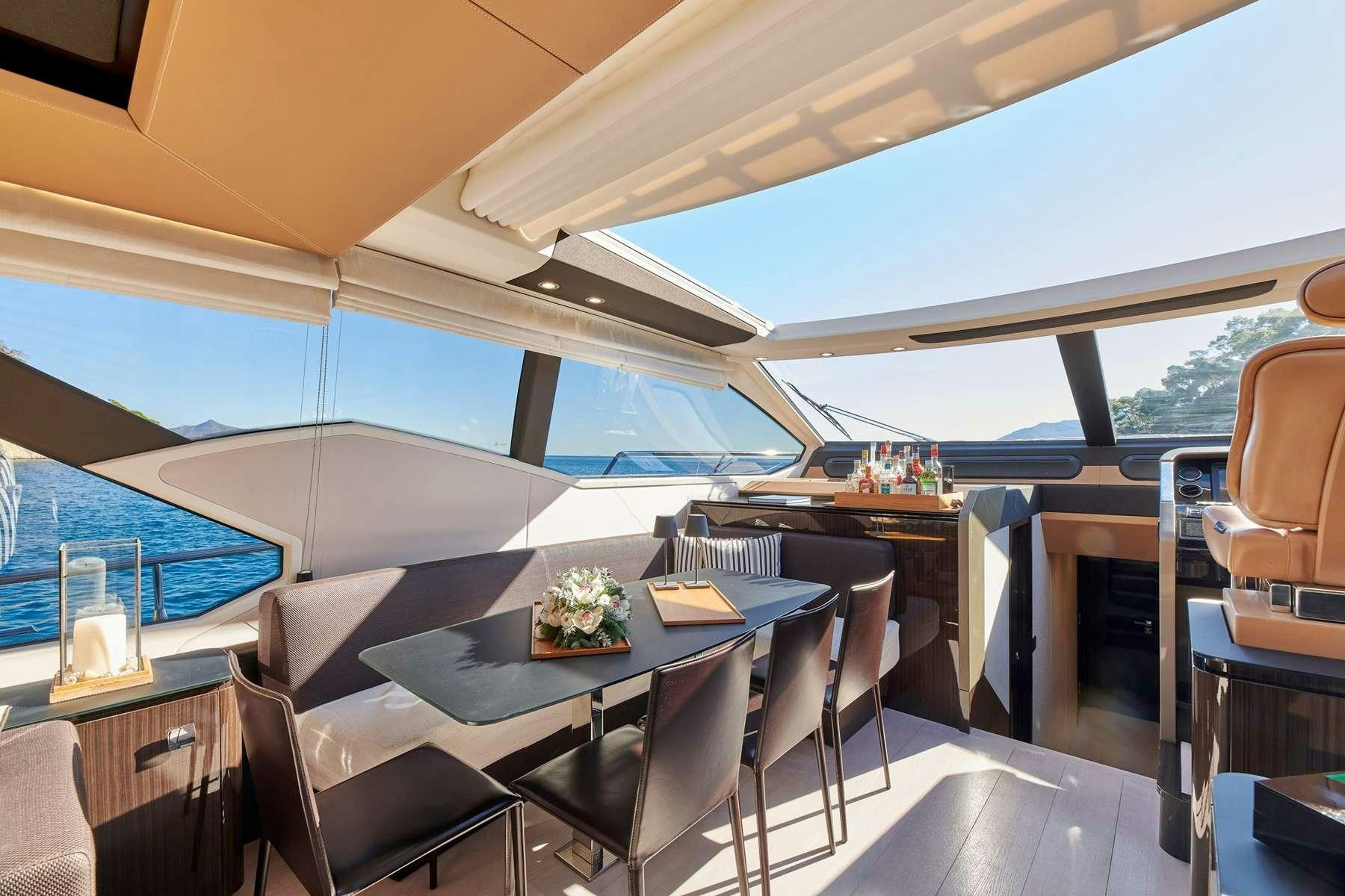 a room with a table and chairs aboard ALKYONE Yacht for Charter