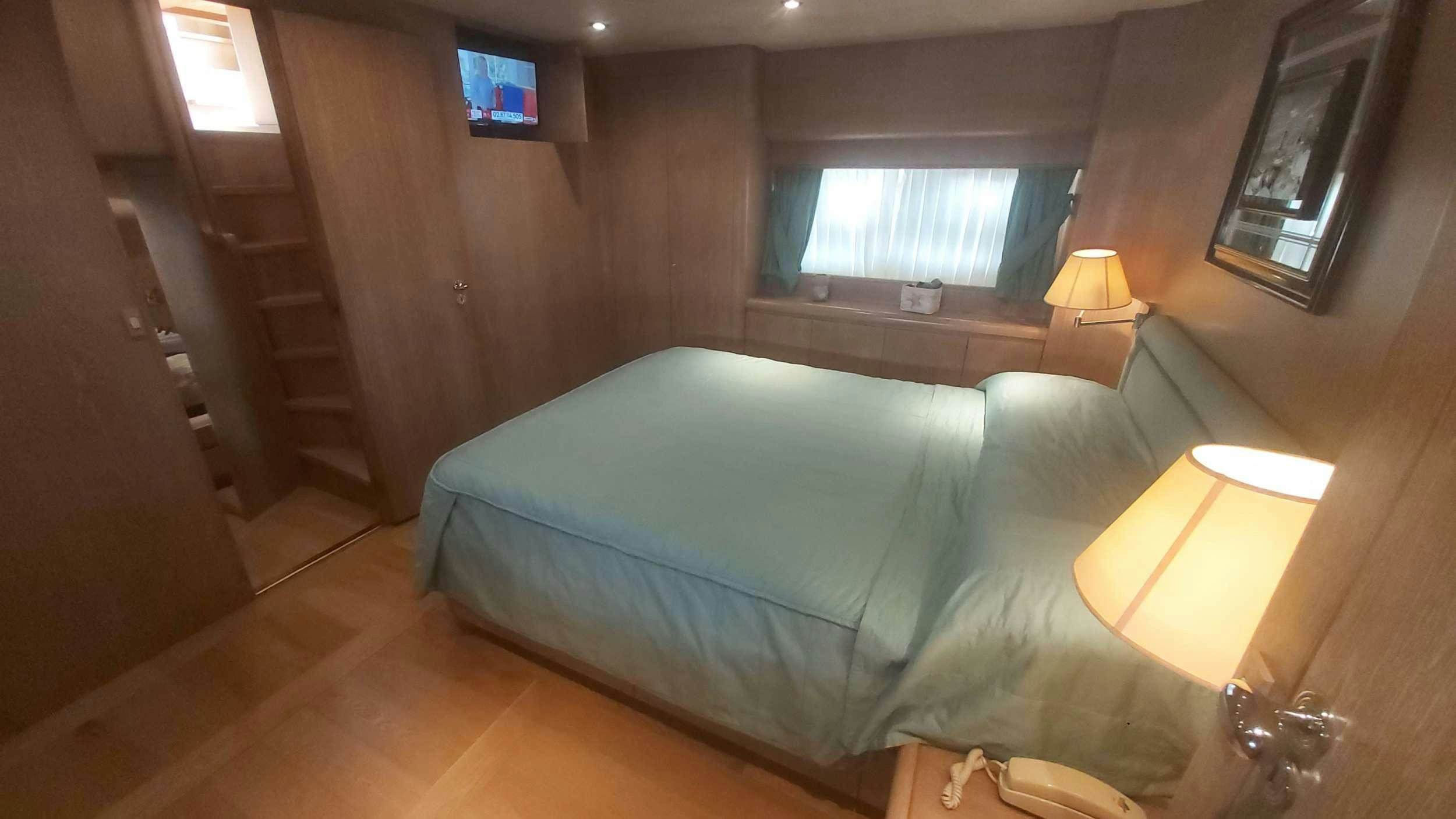 a bed in a room aboard San Matteo Yacht for Charter