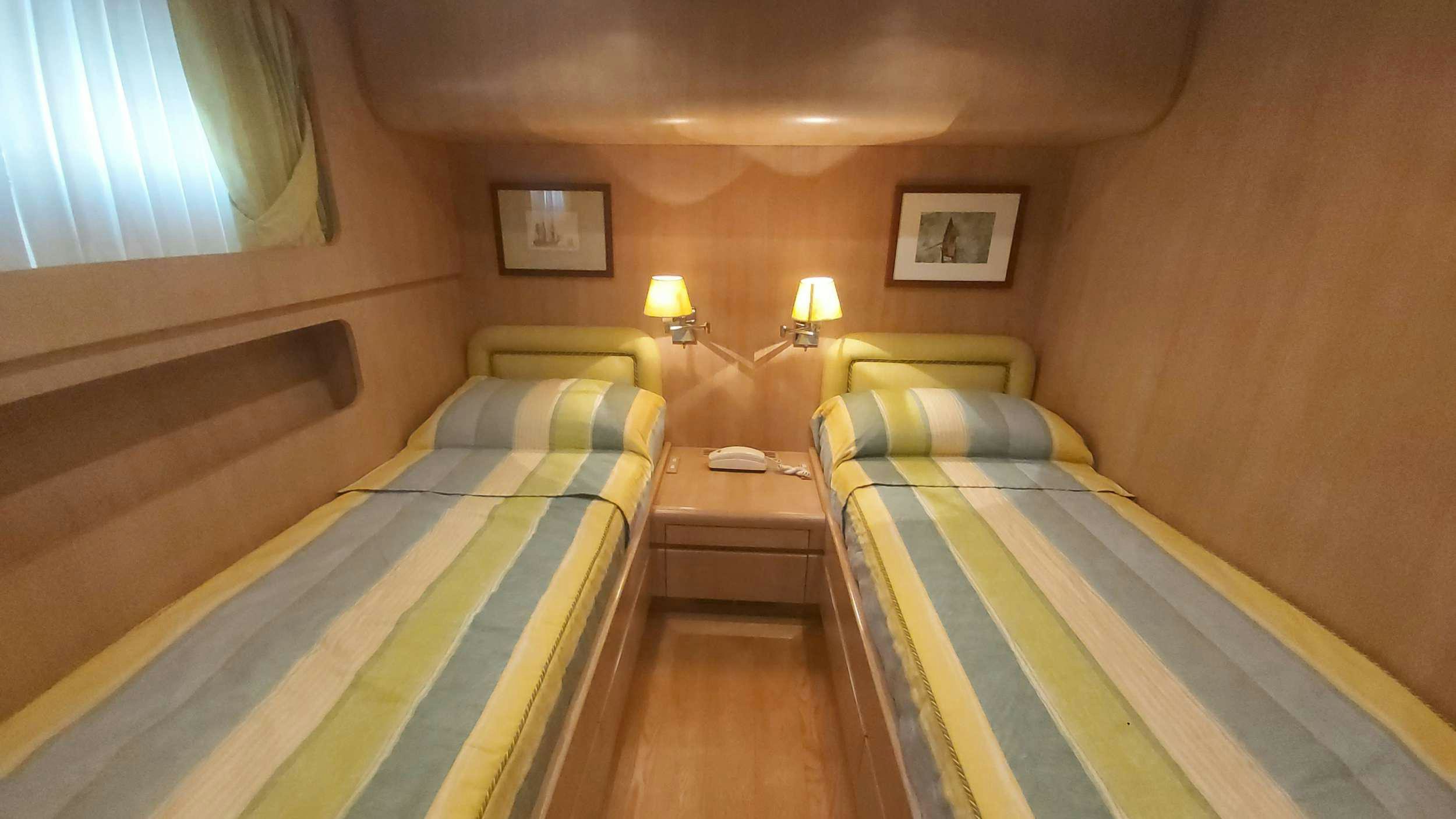 a room with two beds aboard San Matteo Yacht for Charter