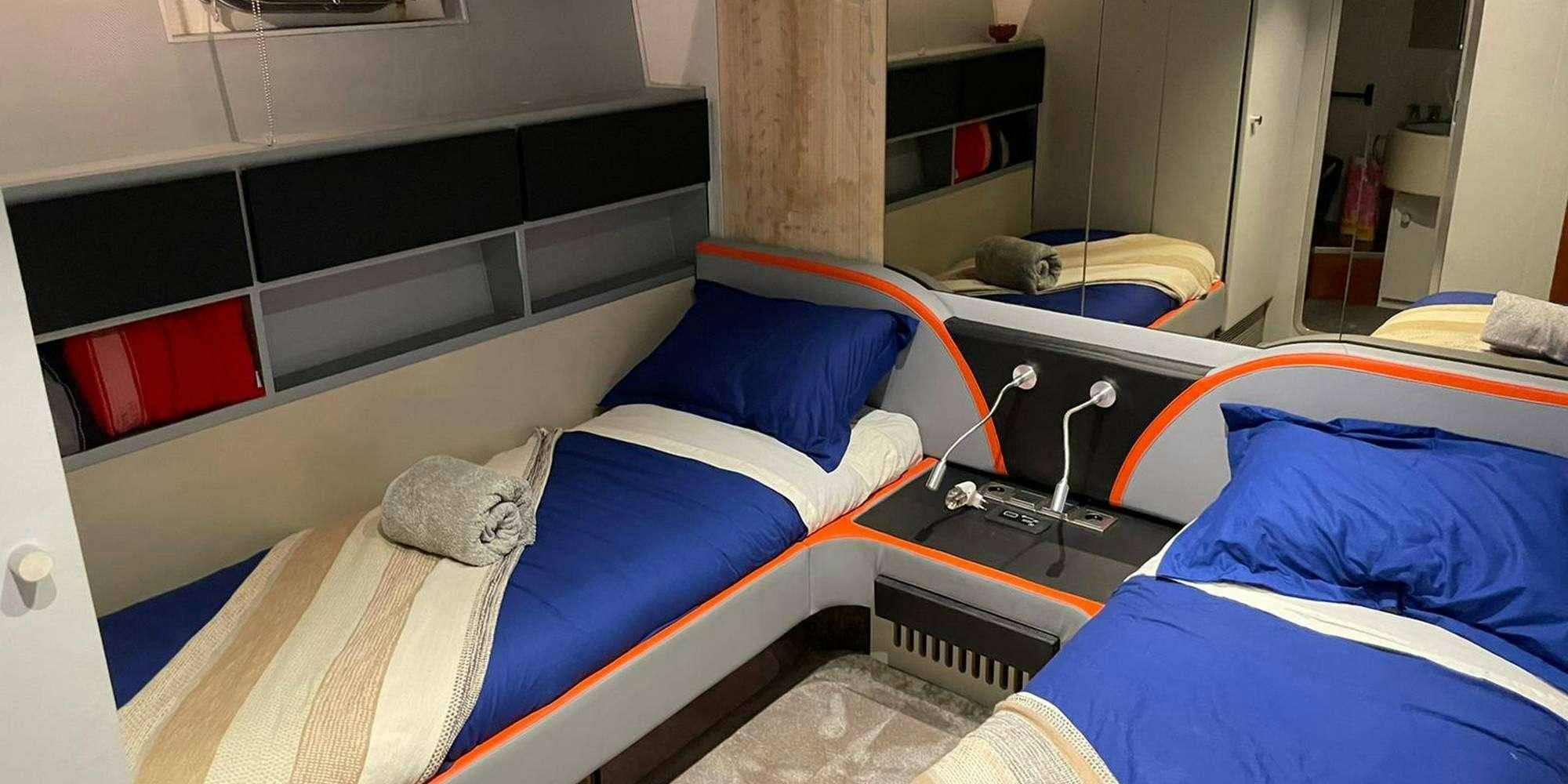 a room with bunk beds aboard SEA SEVEN Yacht for Charter