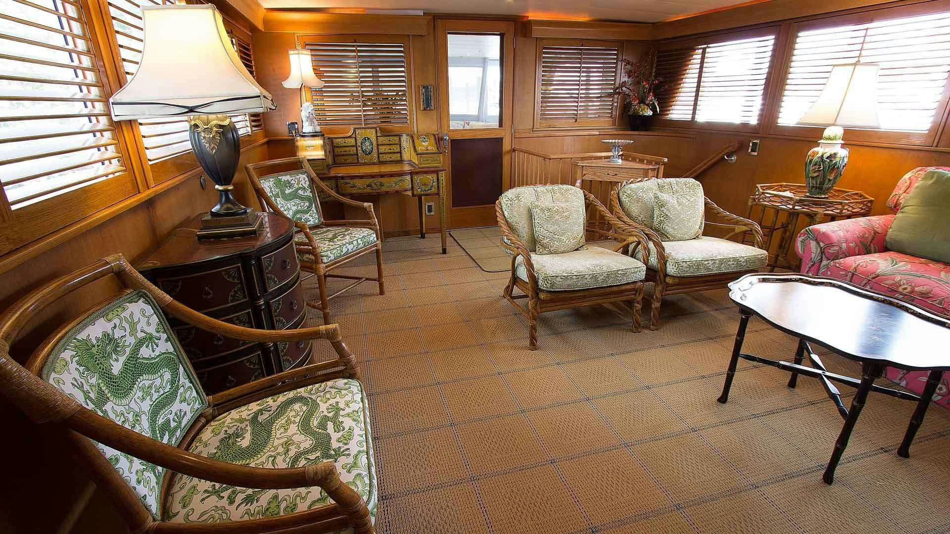 a living room with a table and chairs aboard KOALA Yacht for Charter