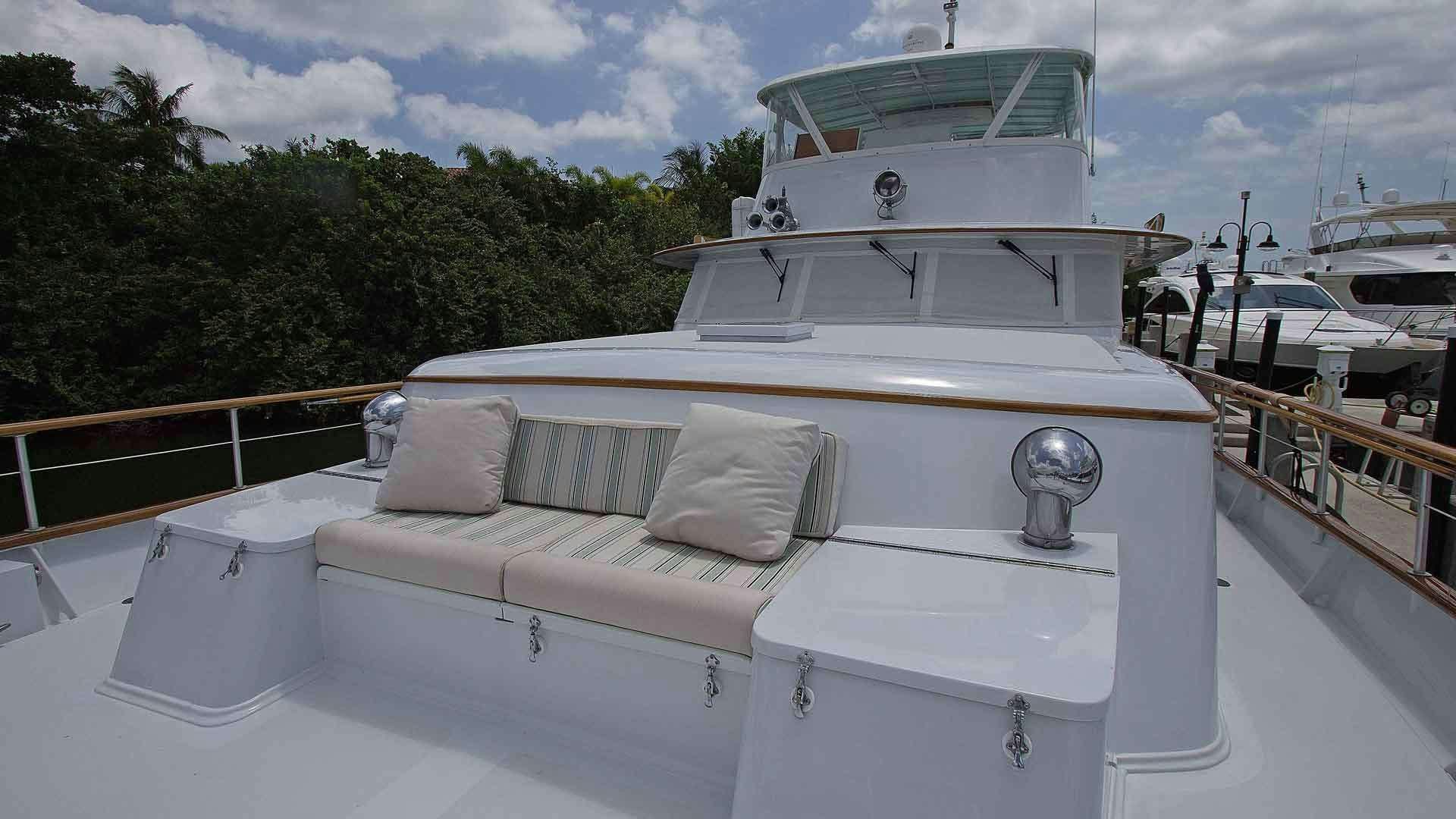 a white boat with pillows on a deck aboard KOALA Yacht for Charter