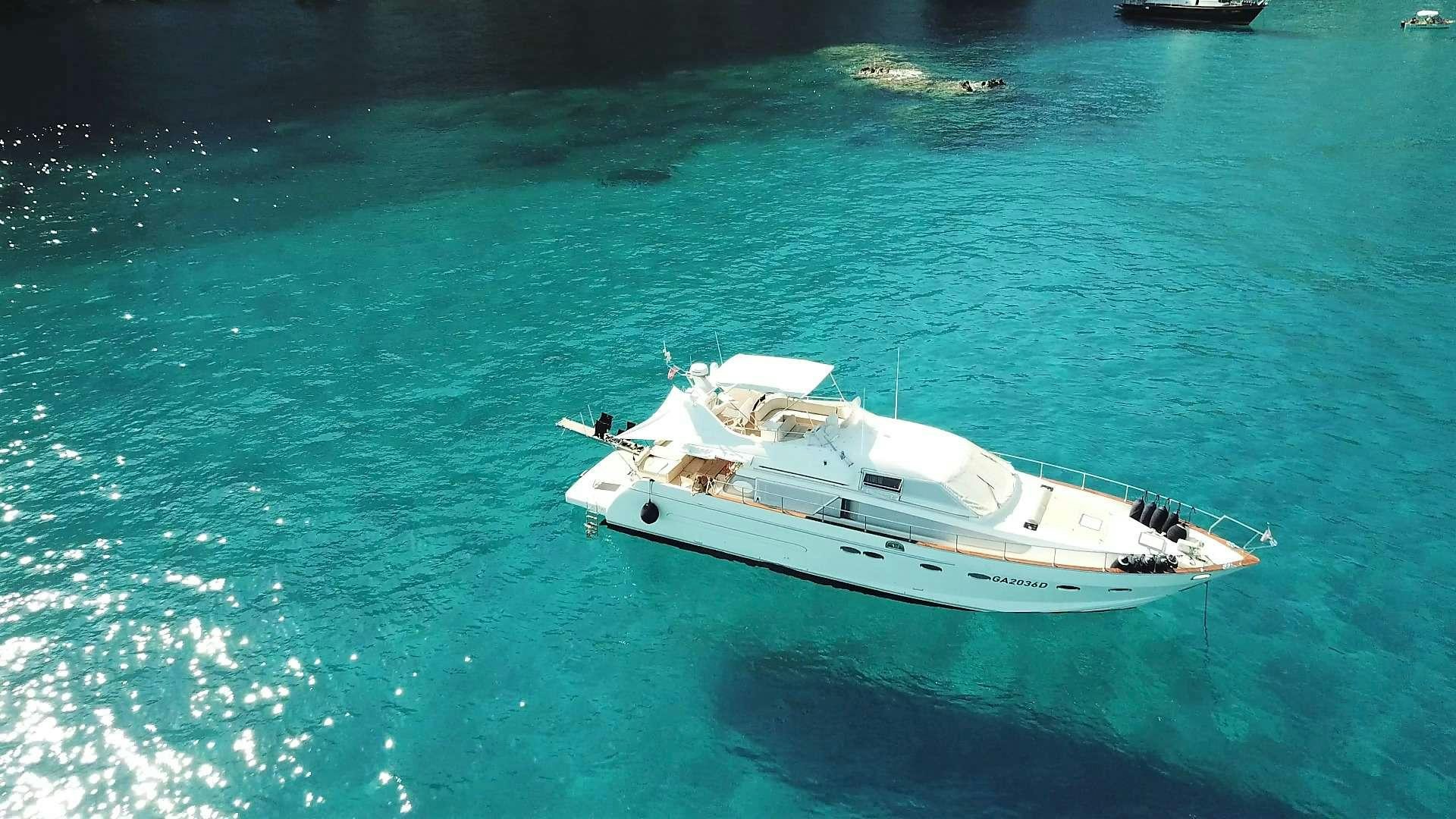 a white boat in the water aboard Boomerang II Yacht for Charter