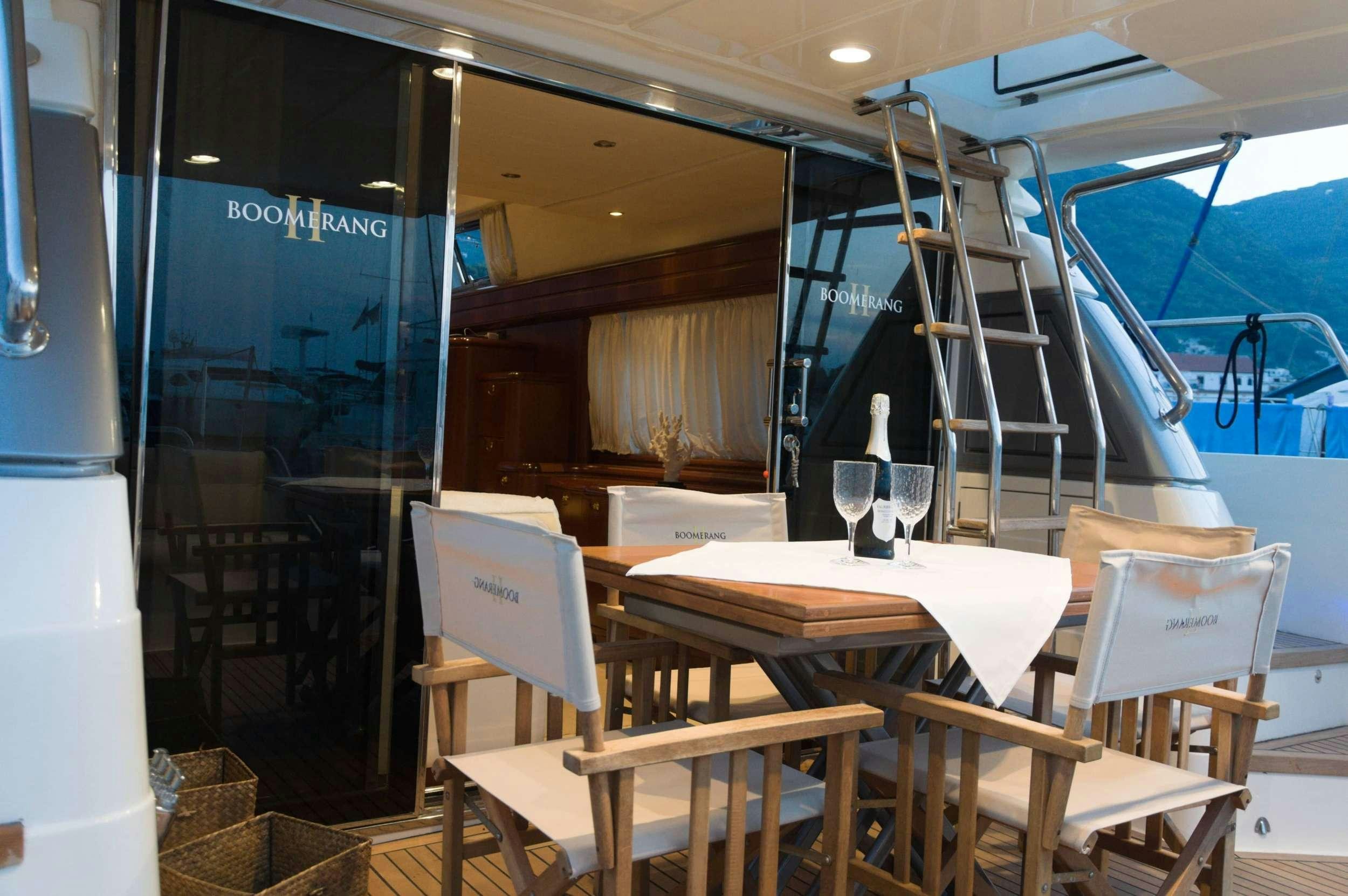 a restaurant with tables and chairs aboard Boomerang II Yacht for Charter