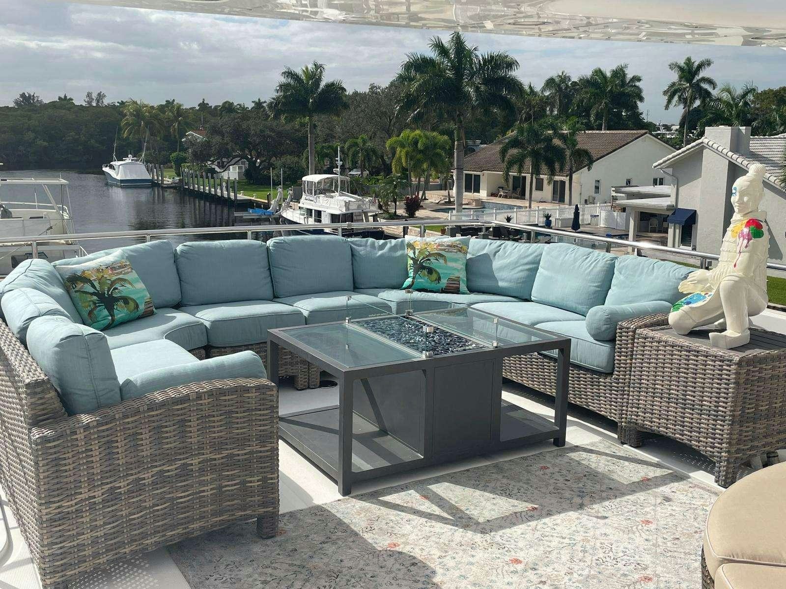 a patio with a table and chairs aboard SCOTT FREE Yacht for Charter