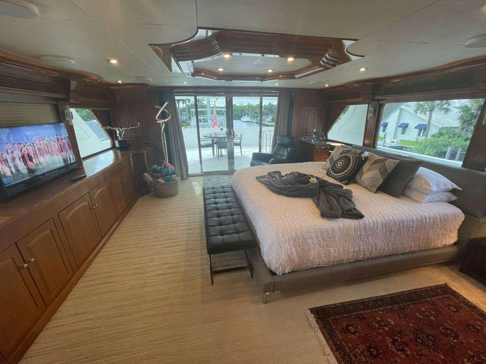 a bedroom with a large bed aboard SCOTT FREE Yacht for Charter