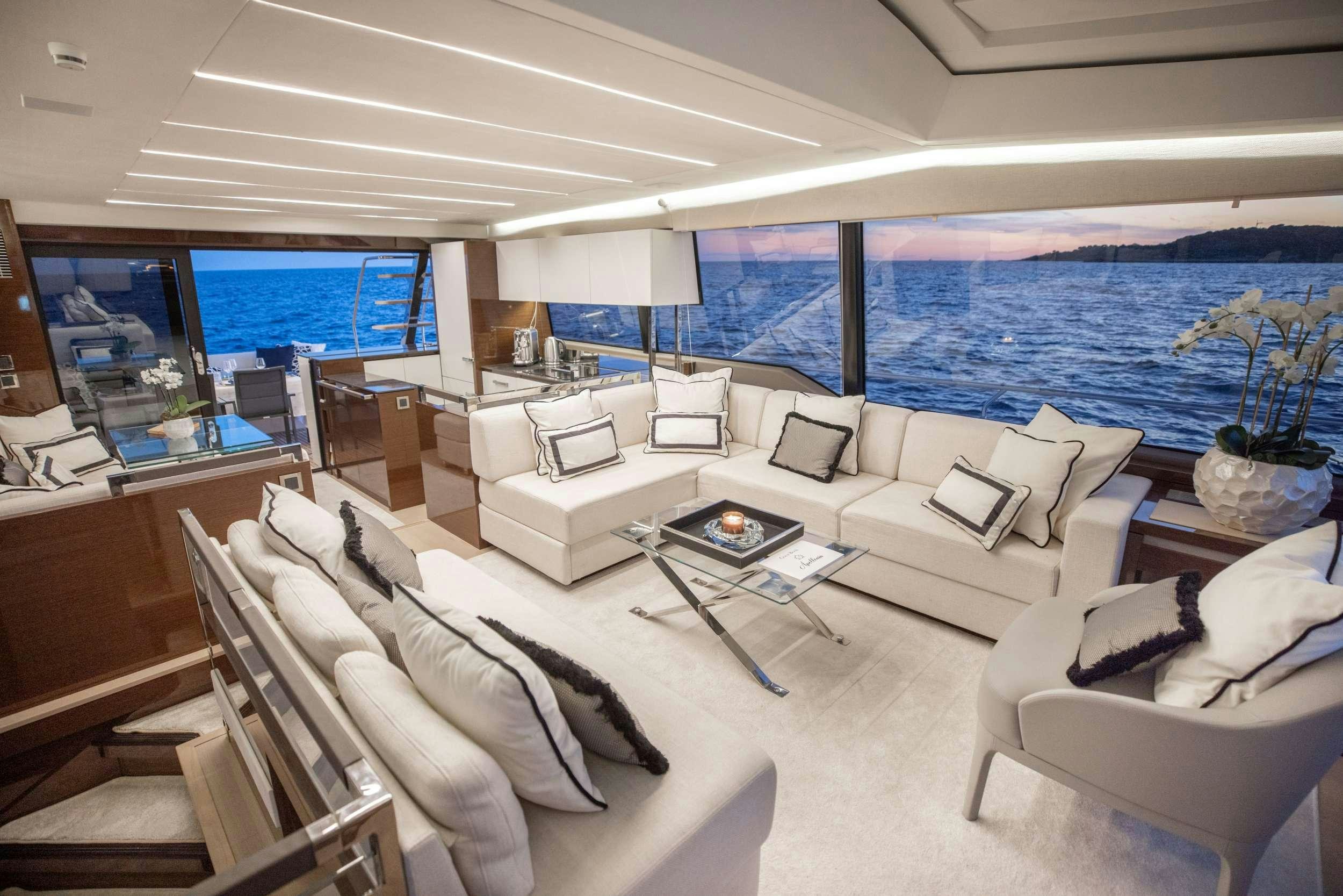 a living room with a large window aboard APOLLONIA Yacht for Charter