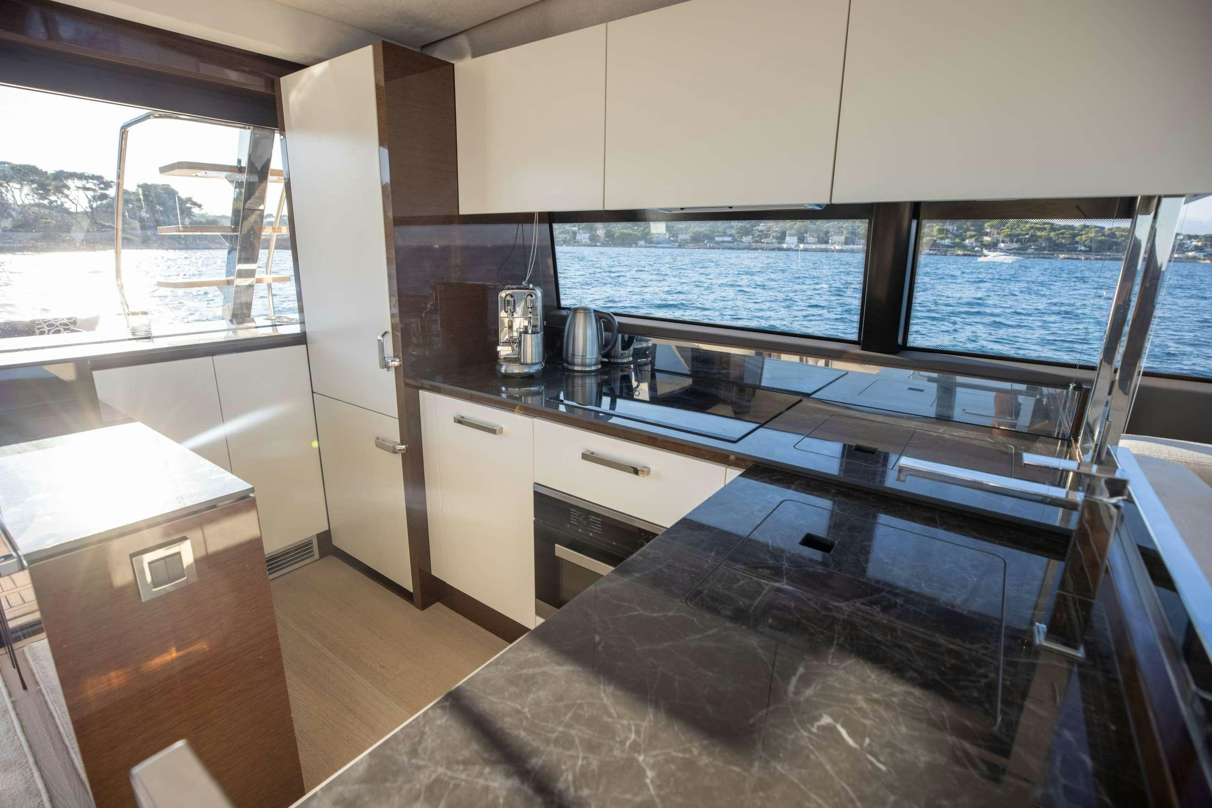 a kitchen with a large island aboard APOLLONIA Yacht for Charter