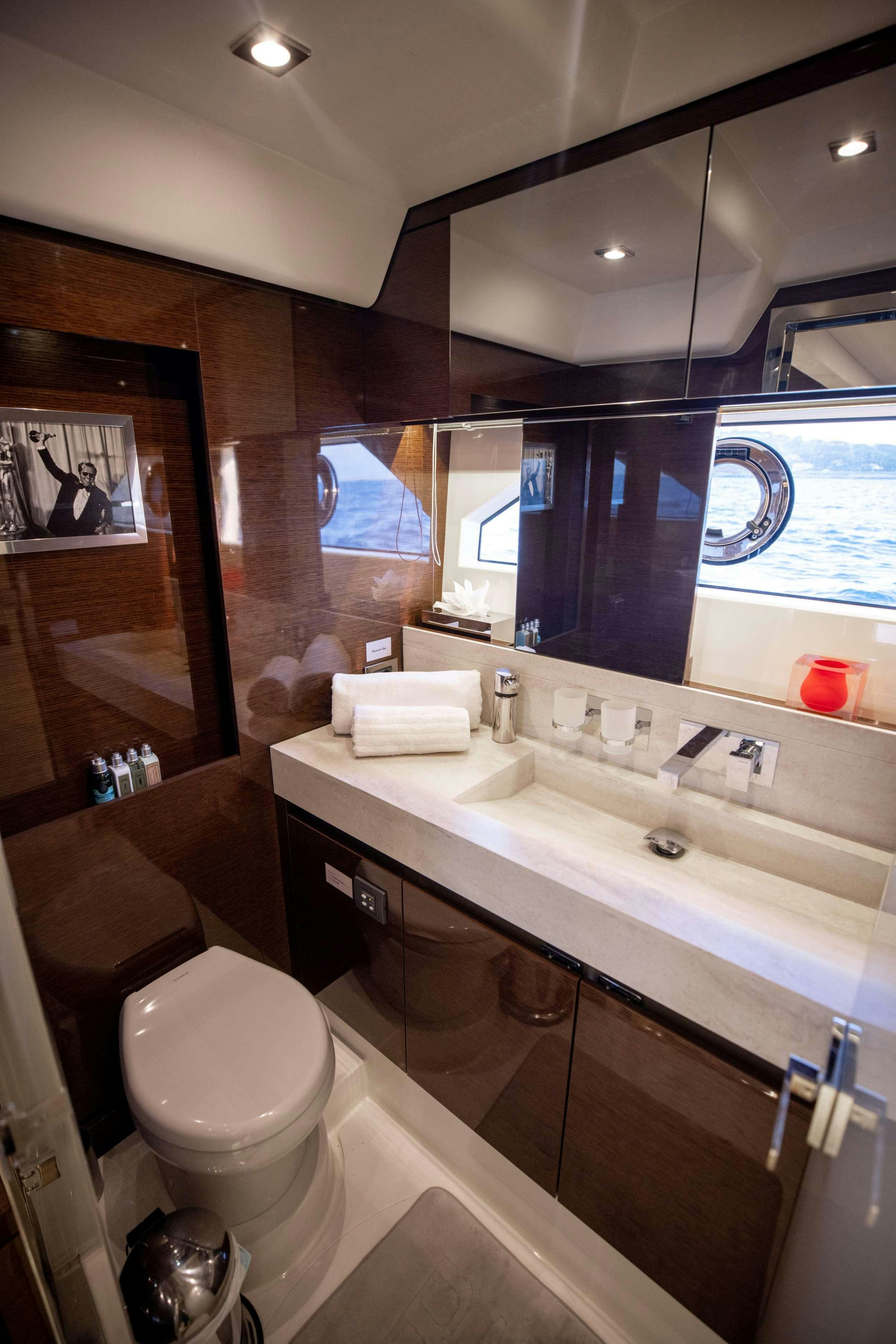 a bathroom with a large mirror aboard APOLLONIA Yacht for Charter