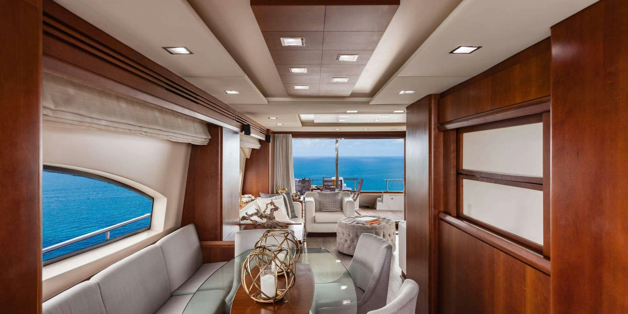 a room with a table and chairs aboard TRUCO II Yacht for Charter
