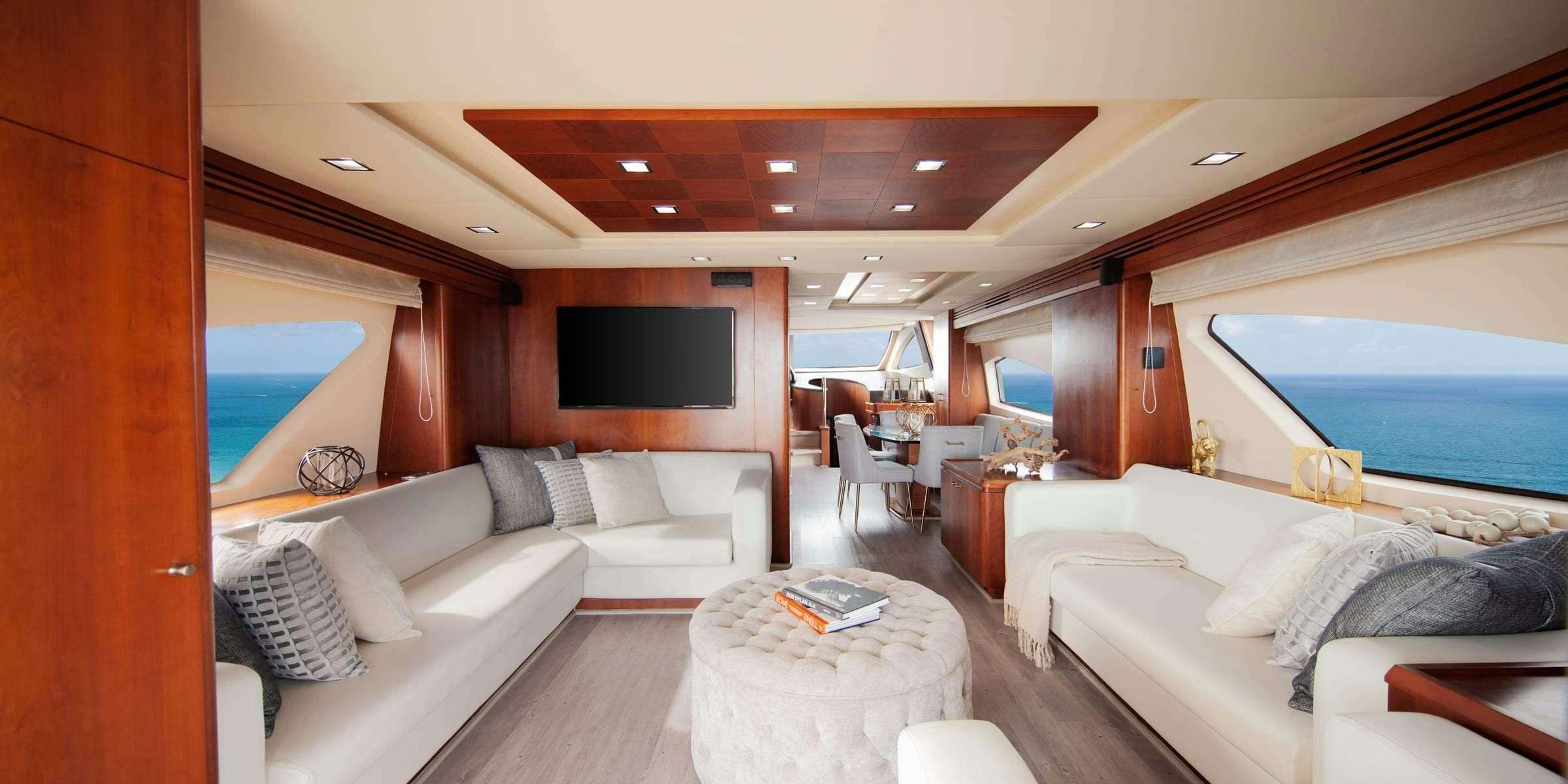 a living room with a large window aboard TRUCO II Yacht for Charter