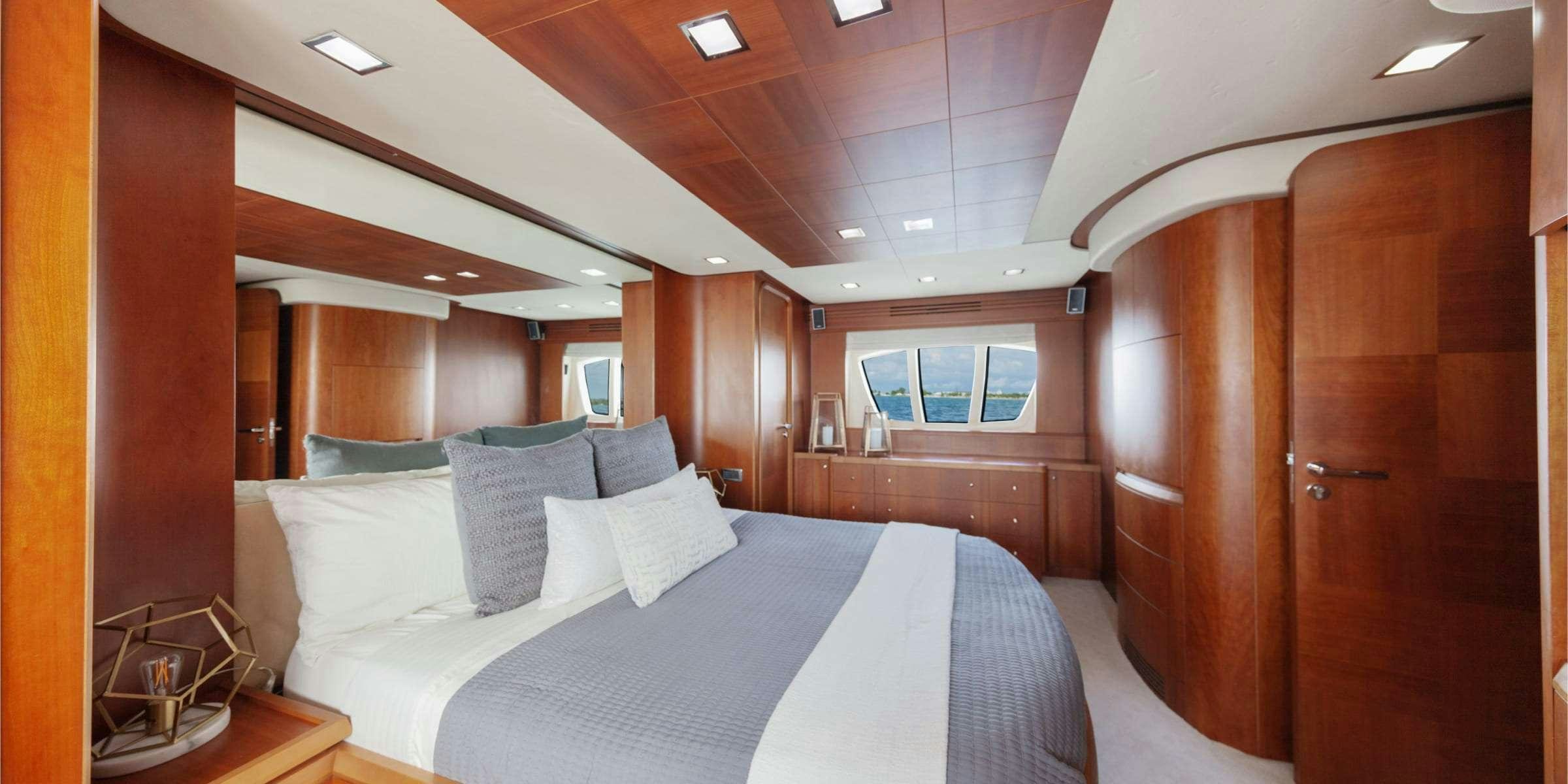 a bed in a room aboard TRUCO II Yacht for Charter