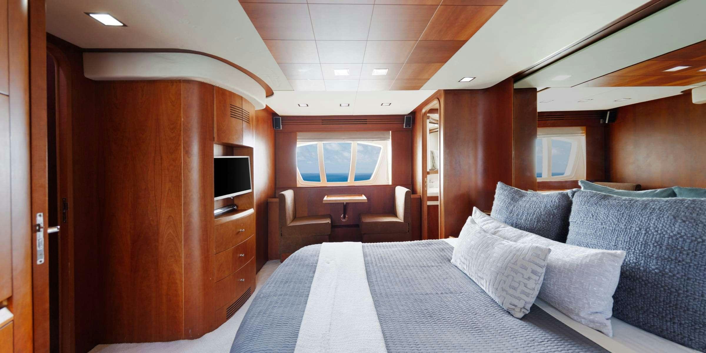 a bed in a room aboard TRUCO II Yacht for Charter