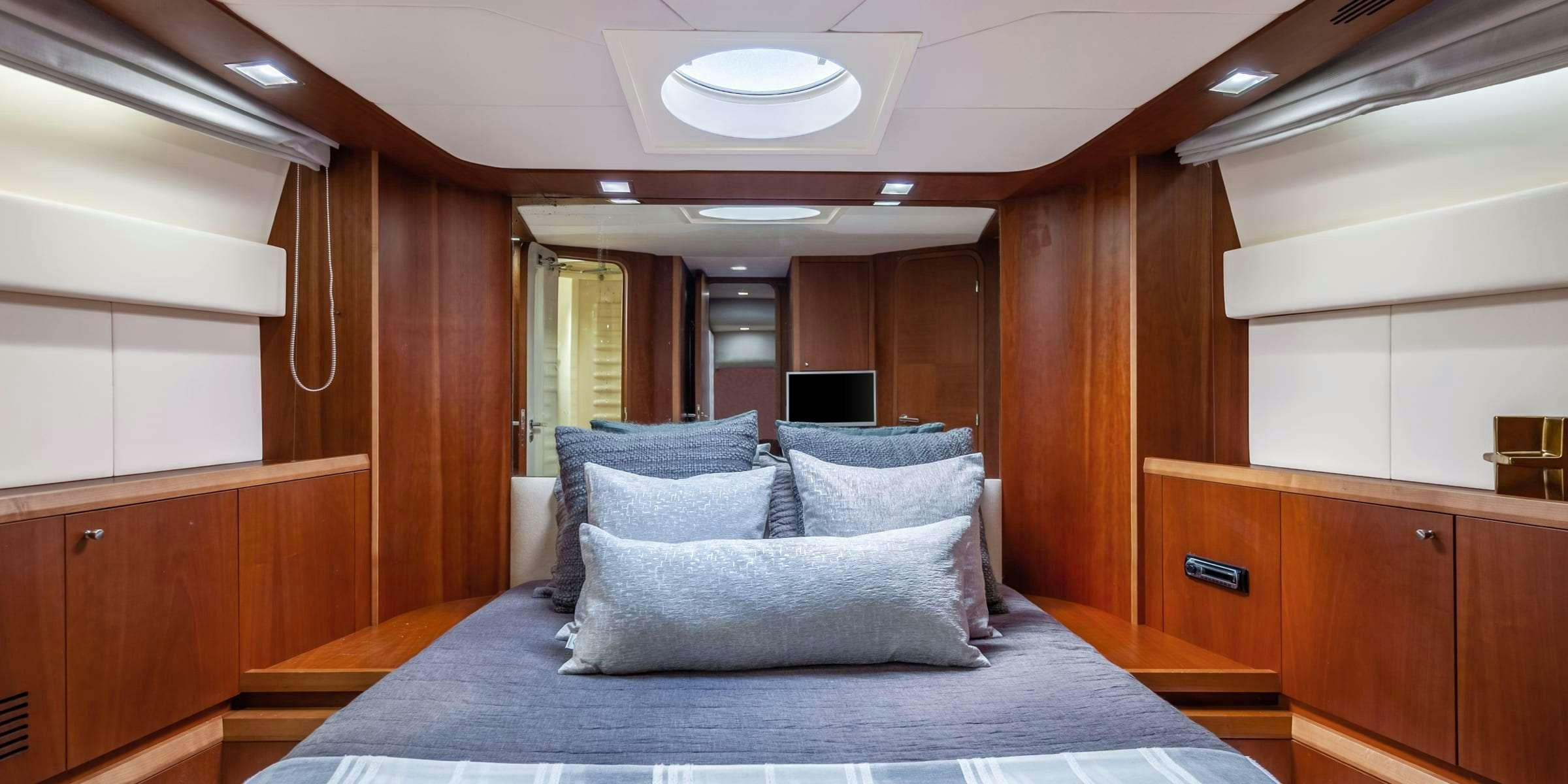 a bed in a room aboard TRUCO II Yacht for Charter