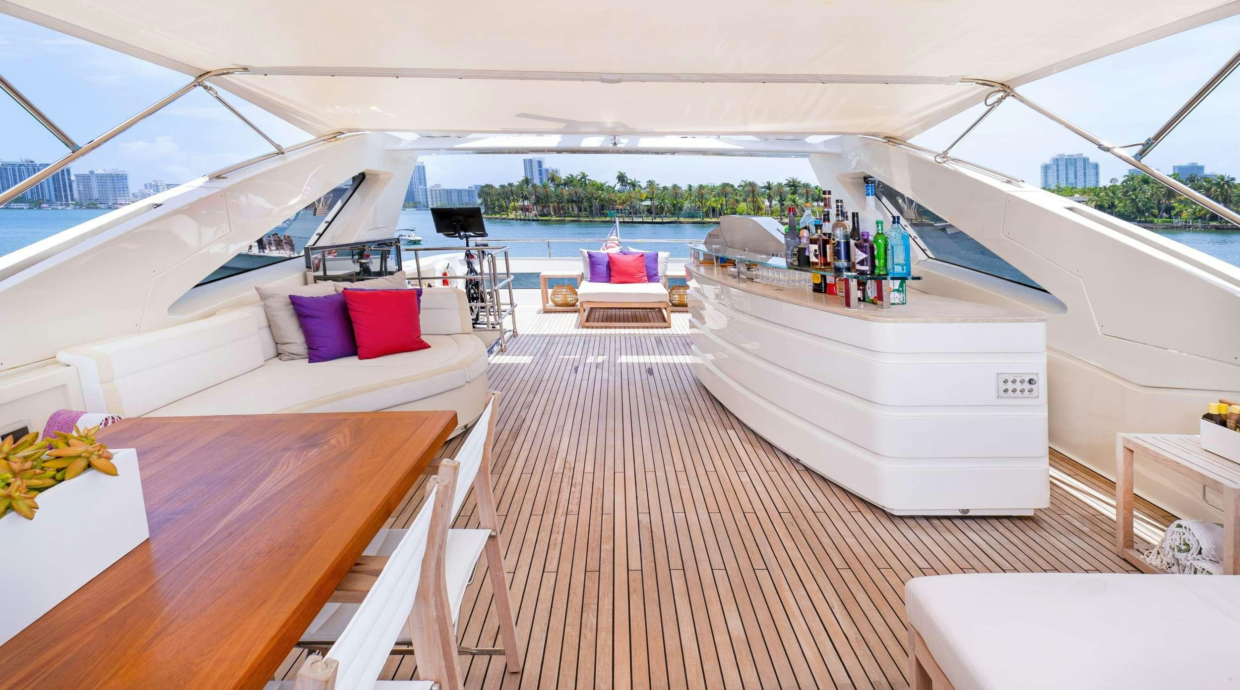 a room with a bed and a table aboard CASUAL Yacht for Charter