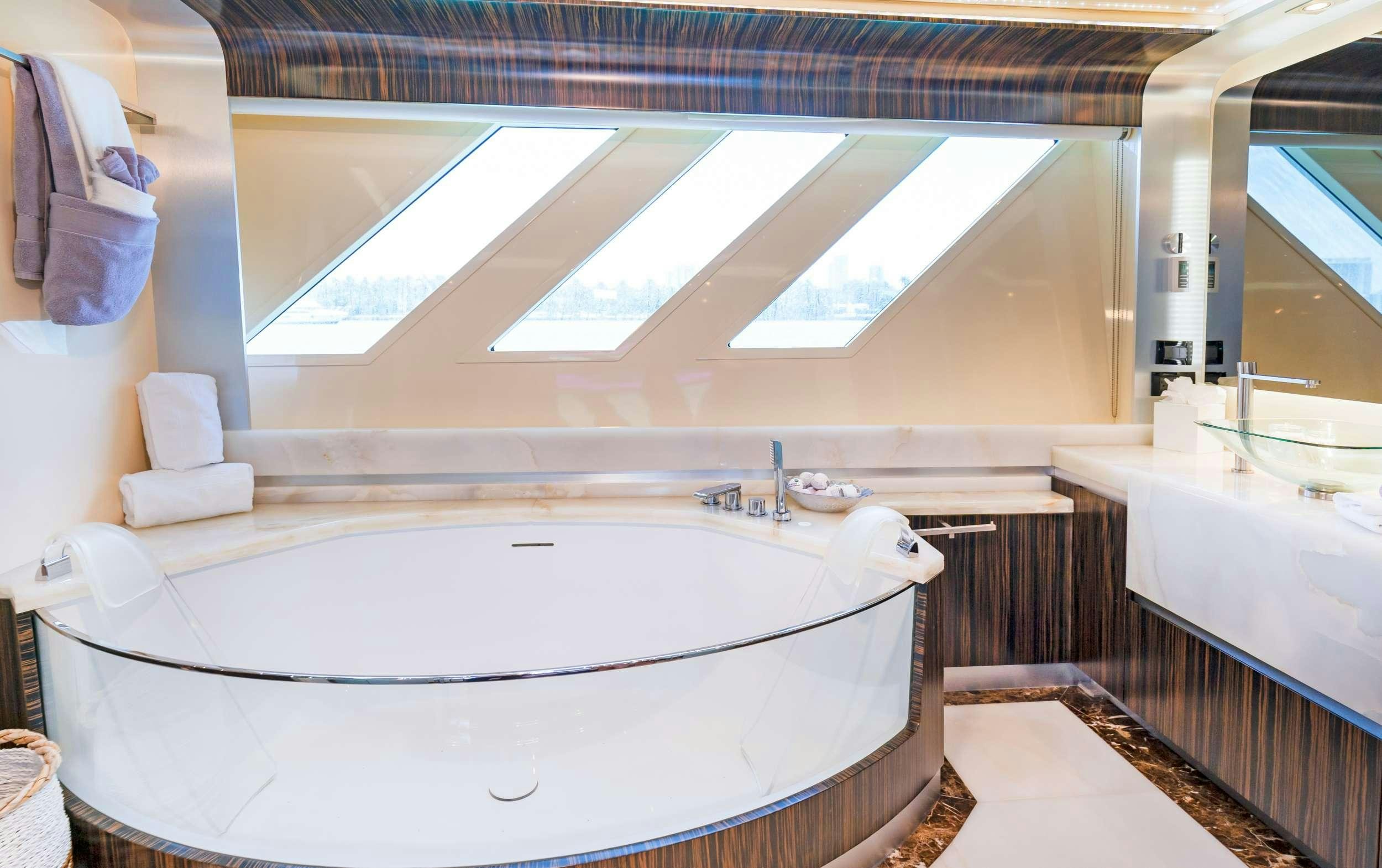 a bathroom with a large bathtub aboard CASUAL Yacht for Charter
