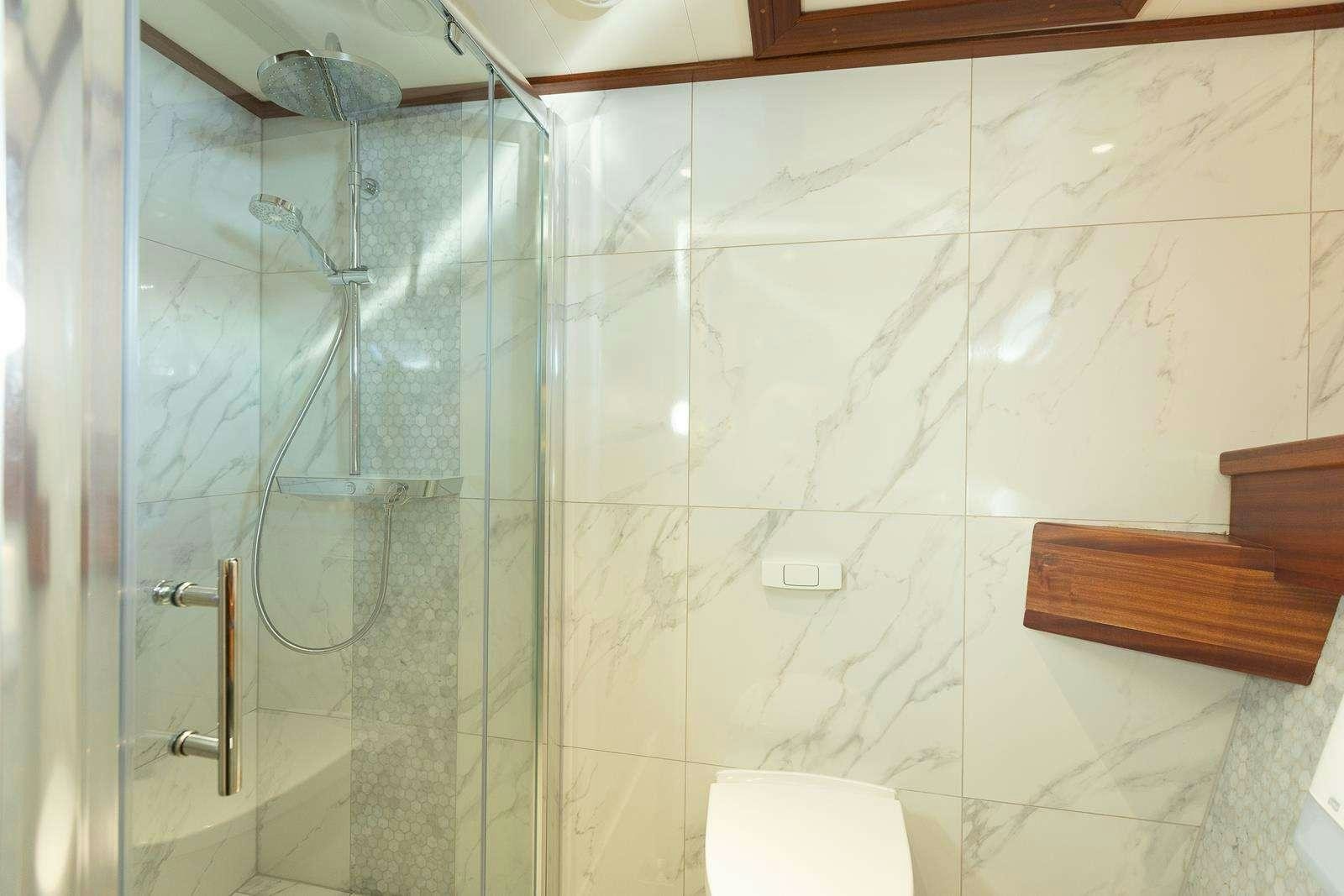a shower with a glass door aboard GALLANT Yacht for Charter