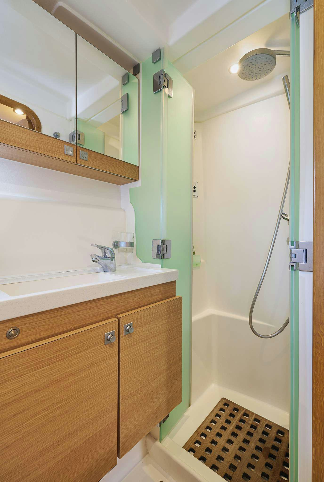 a bathroom with a shower unit aboard STADIUM Yacht for Charter