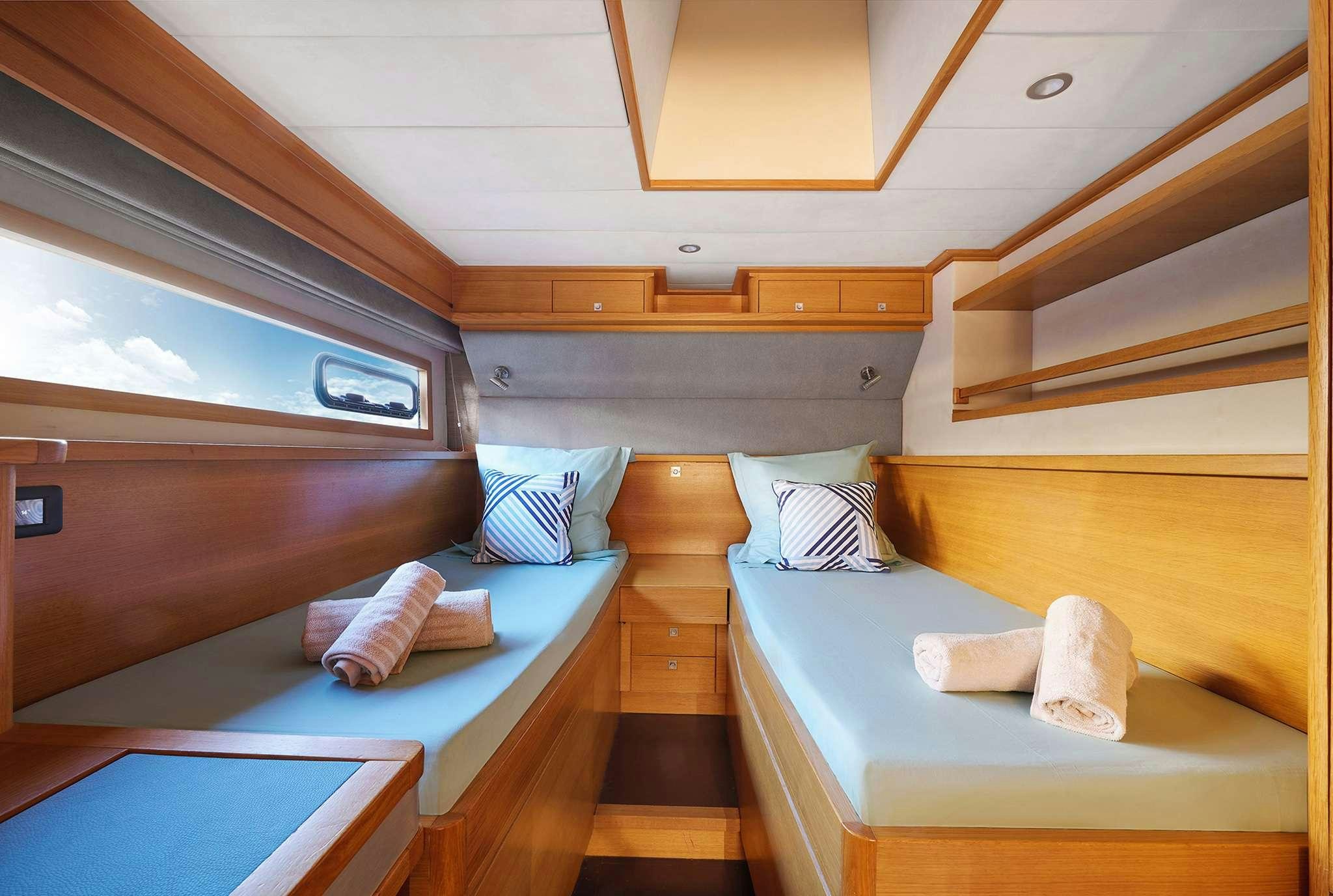 a room with bunk beds aboard STADIUM Yacht for Charter