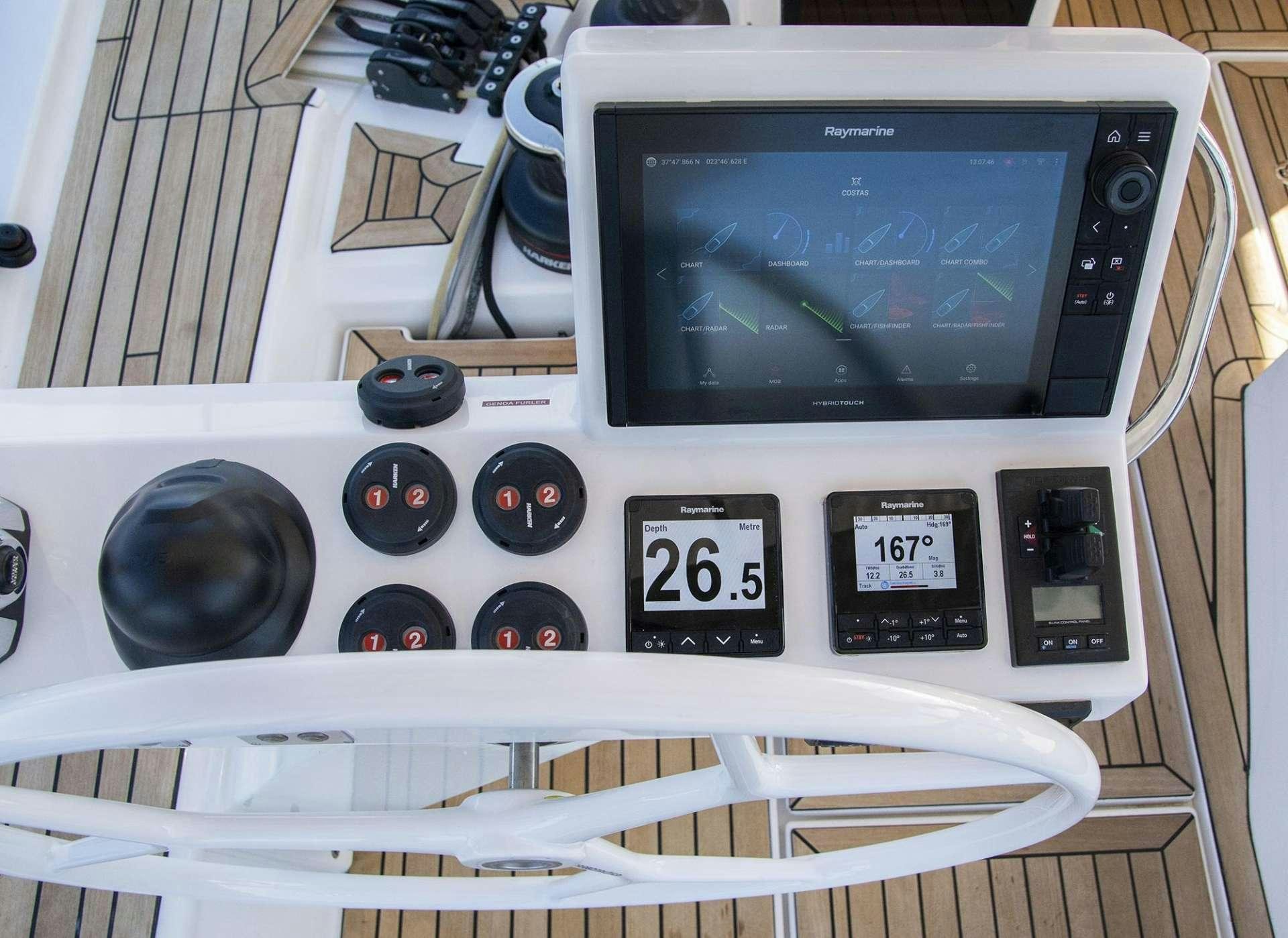 a white microwave with a black knob aboard SOPHIA Yacht for Charter