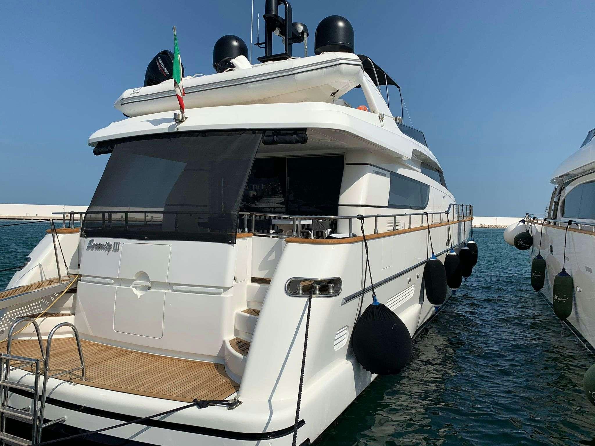 a boat docked at a pier aboard SERENITY III Yacht for Charter