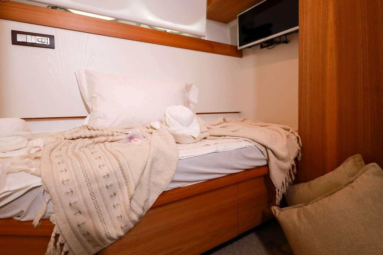 a couple of beds in a room aboard SERENITY III Yacht for Charter