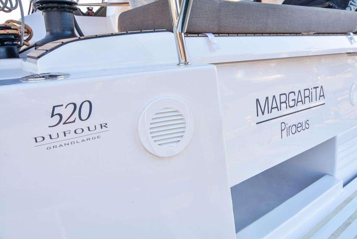 a white box with a logo aboard NINETEEN Yacht for Charter