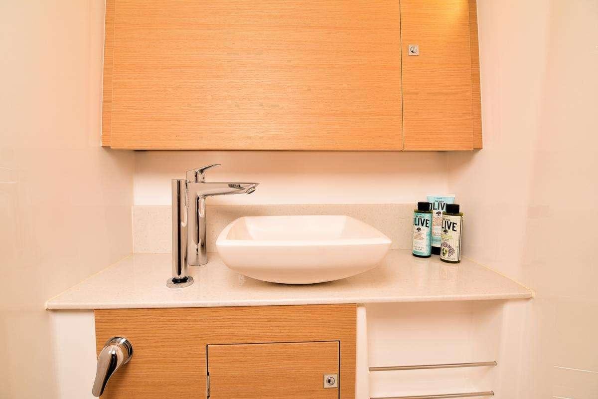 a sink with a faucet aboard NINETEEN Yacht for Charter